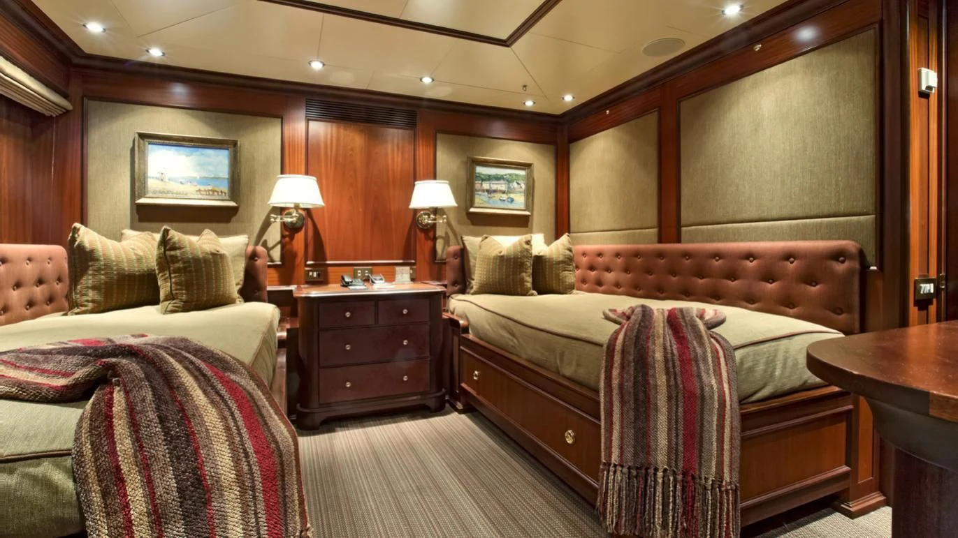a room with two beds aboard VIXIT Yacht for Sale
