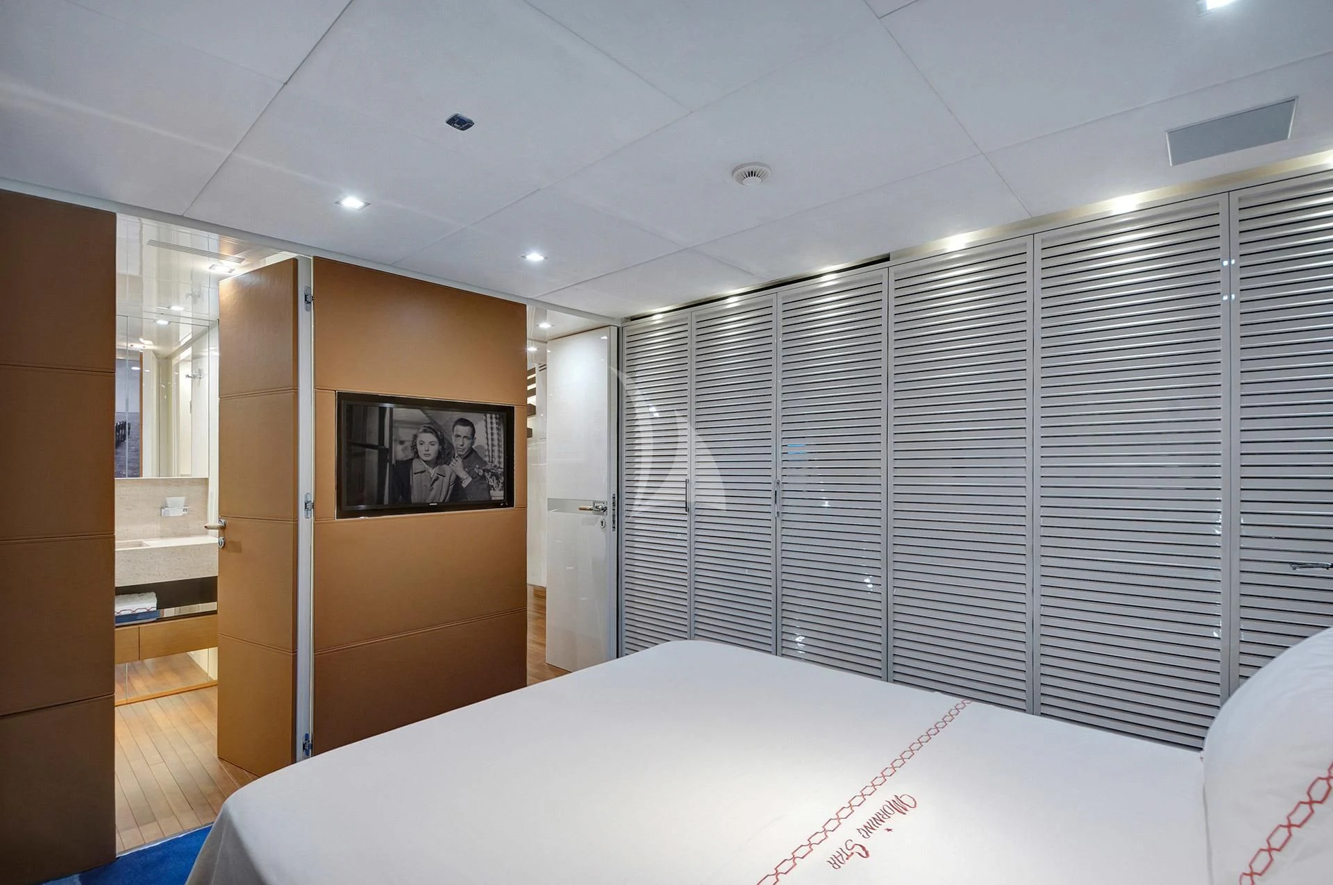 a room with a bed and a window aboard MORNING STAR Yacht for Charter