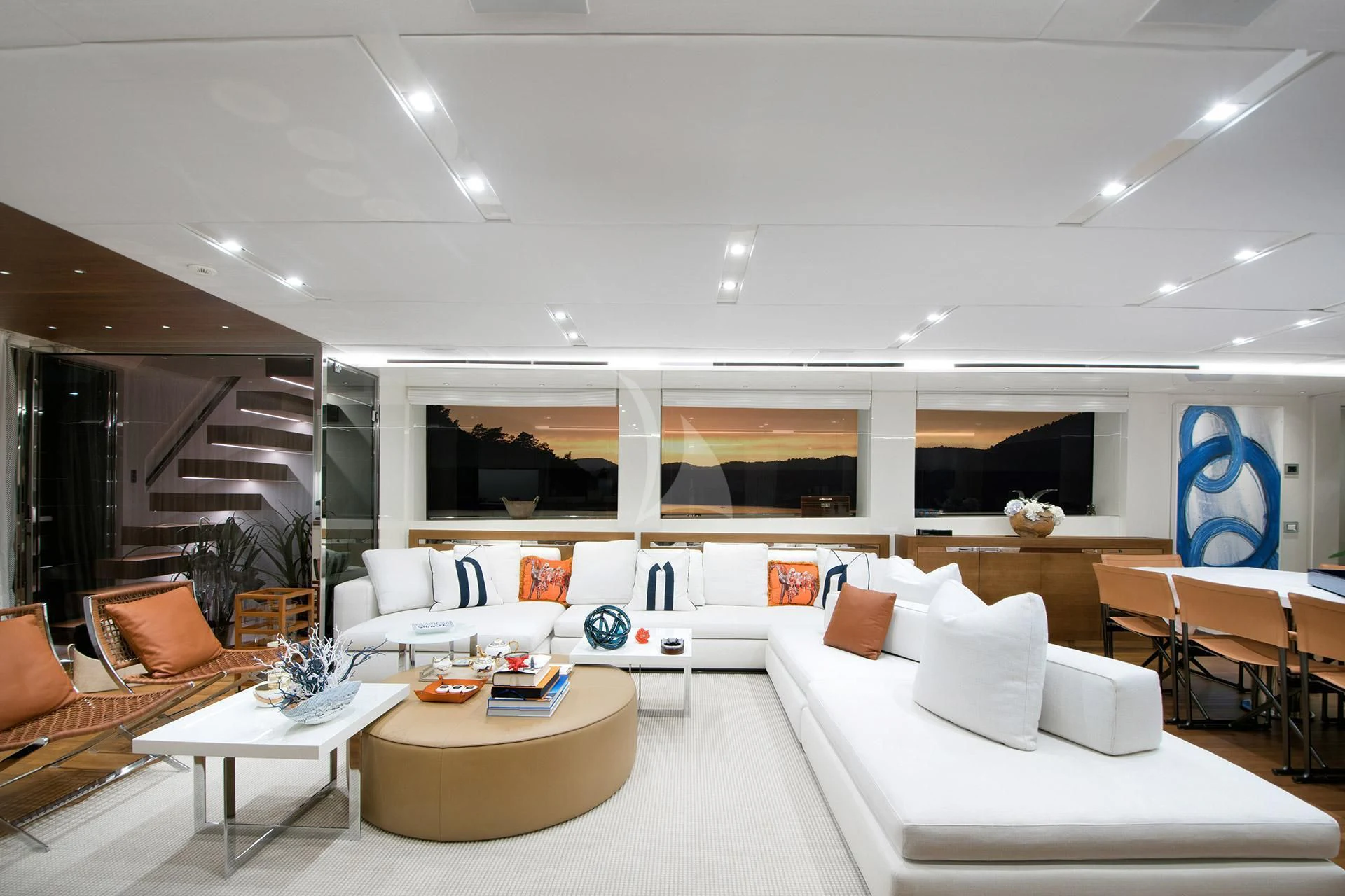 a room with white furniture aboard MORNING STAR Yacht for Charter