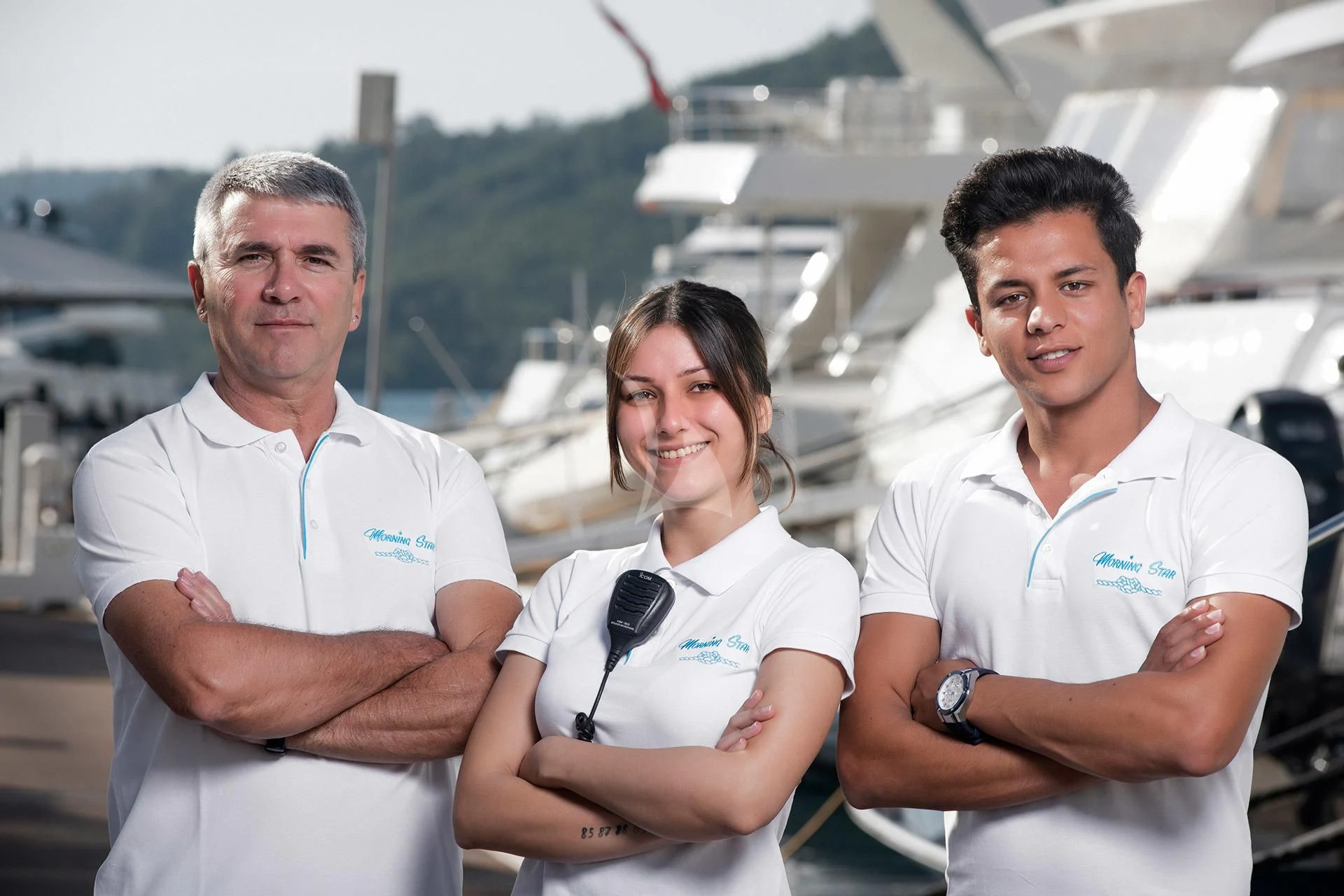 a group of people posing for a photo aboard MORNING STAR Yacht for Charter