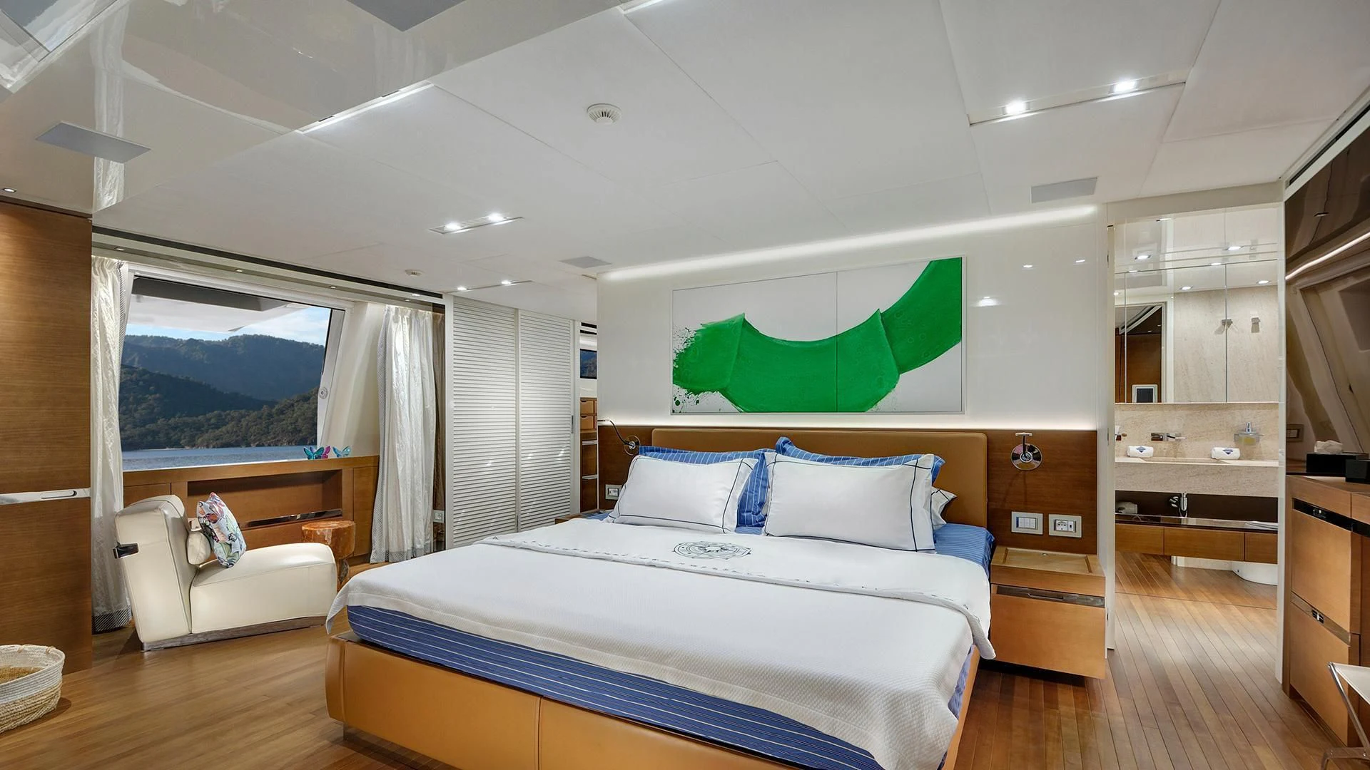 a bedroom with a bed and a large window aboard MORNING STAR Yacht for Charter