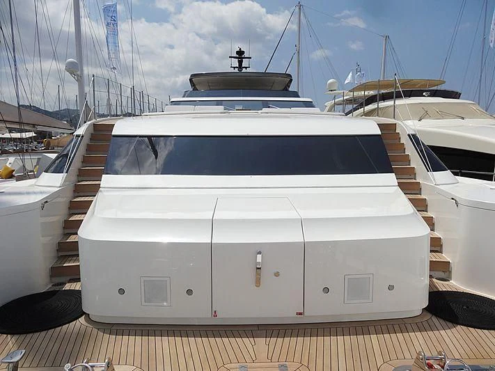 a white boat in a harbor aboard MORNING STAR Yacht for Charter
