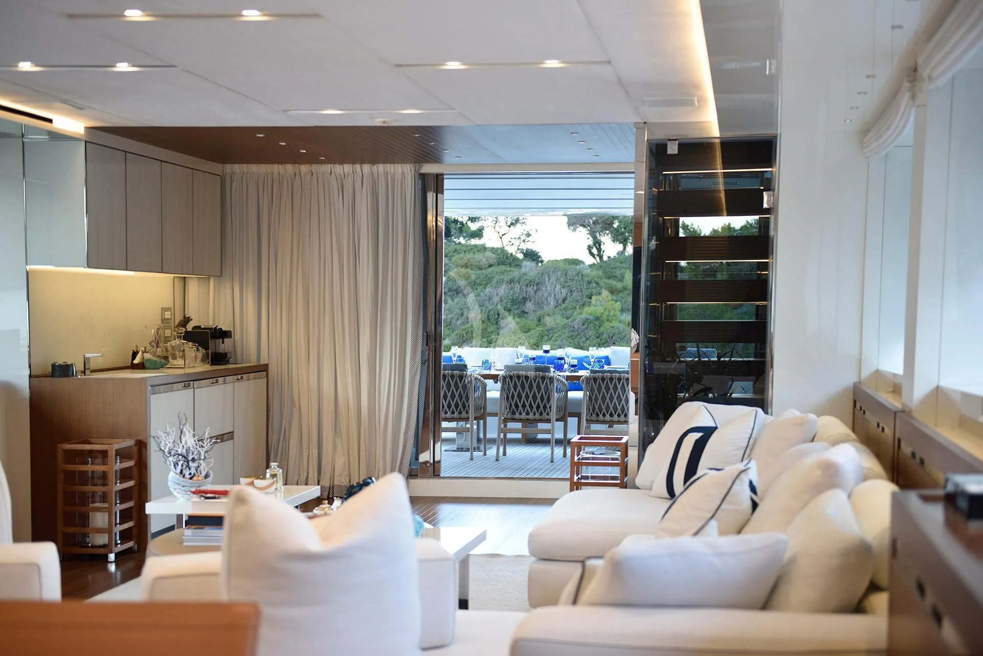 a living room with a large window aboard MORNING STAR Yacht for Charter