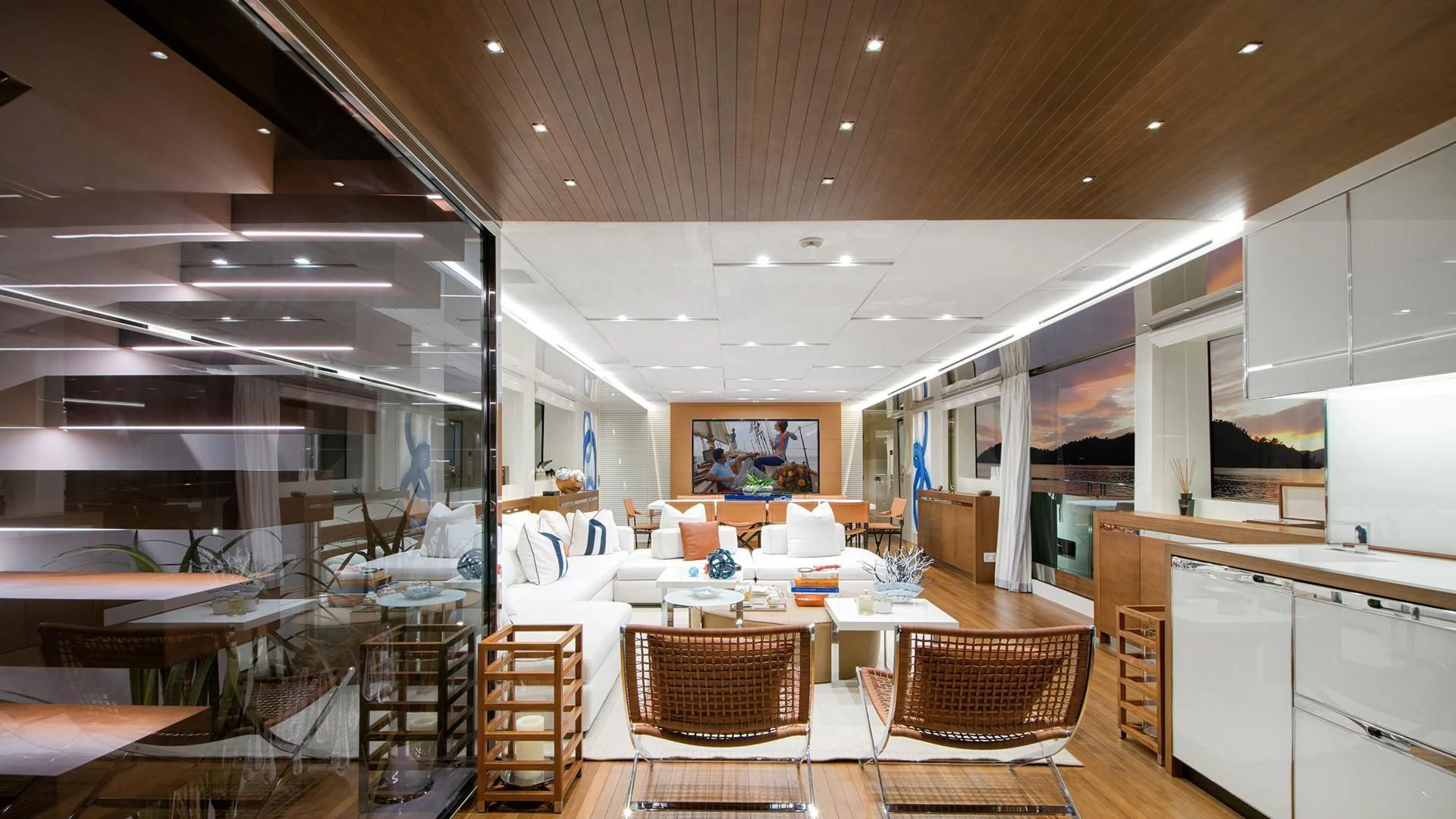 a room with tables chairs and a large window aboard MORNING STAR Yacht for Charter
