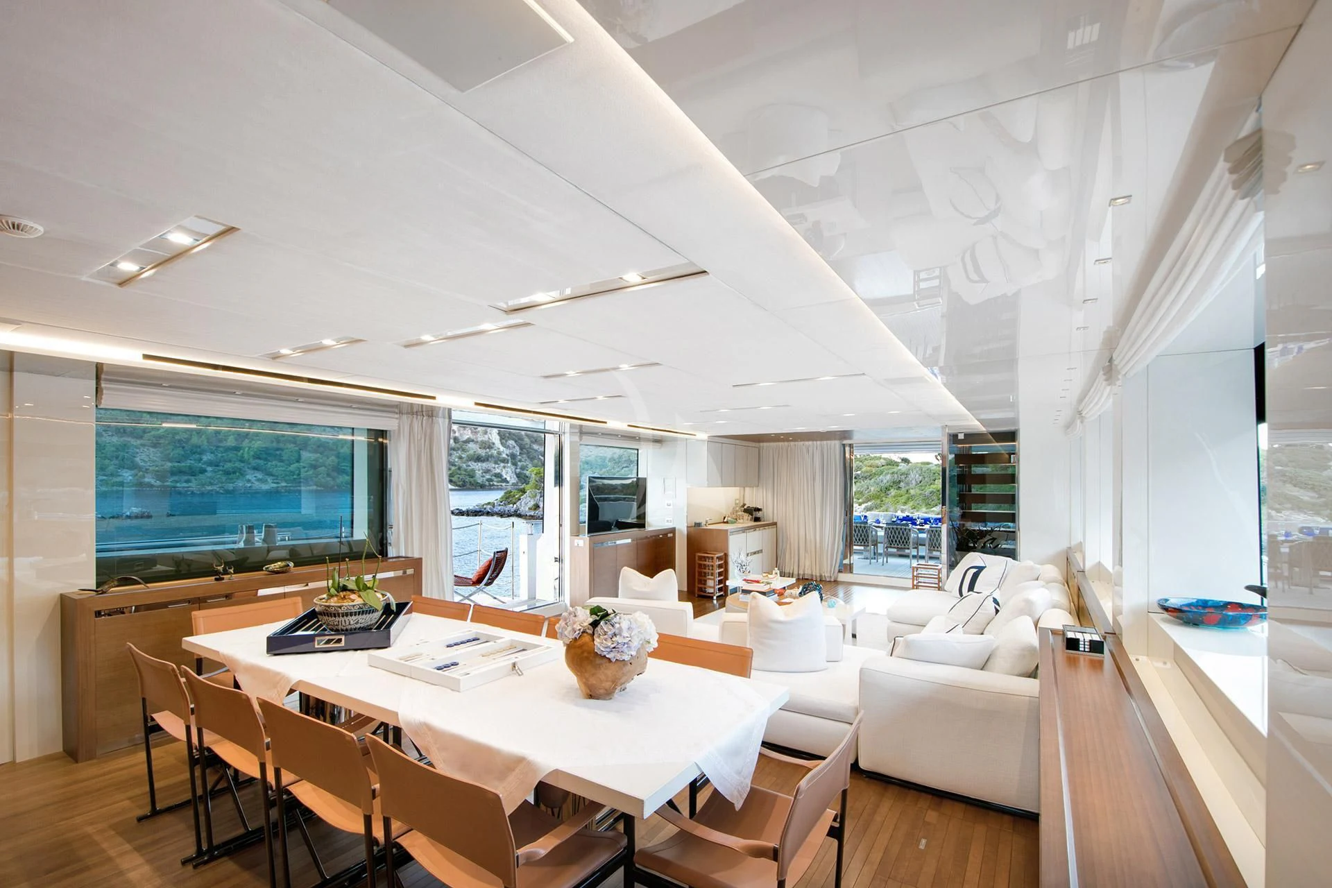 a room with a table and chairs aboard MORNING STAR Yacht for Charter