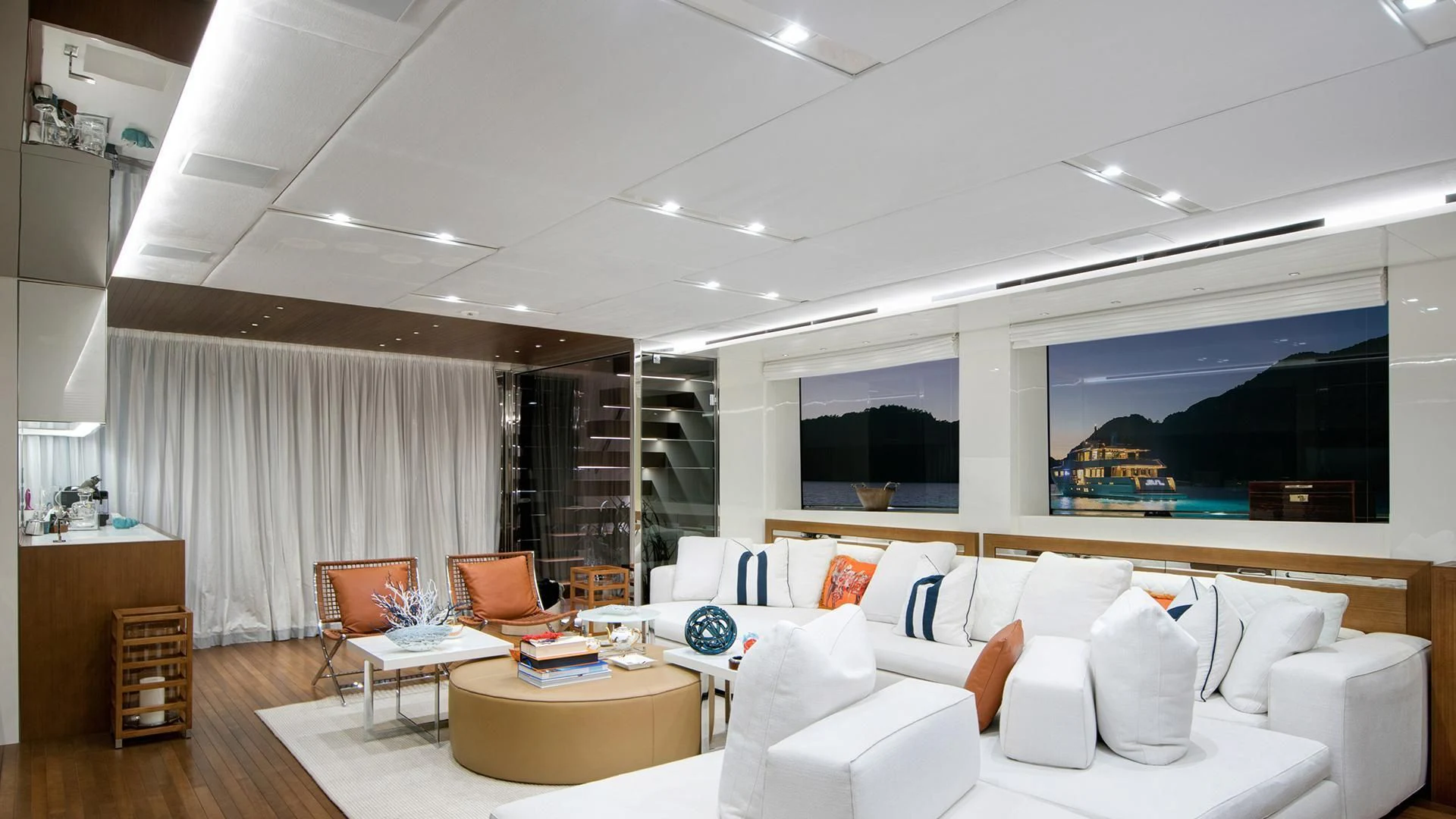 a living room with a large window aboard MORNING STAR Yacht for Charter