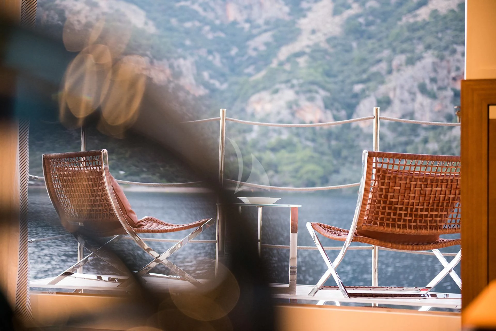 a couple of chairs on a balcony aboard MORNING STAR Yacht for Charter