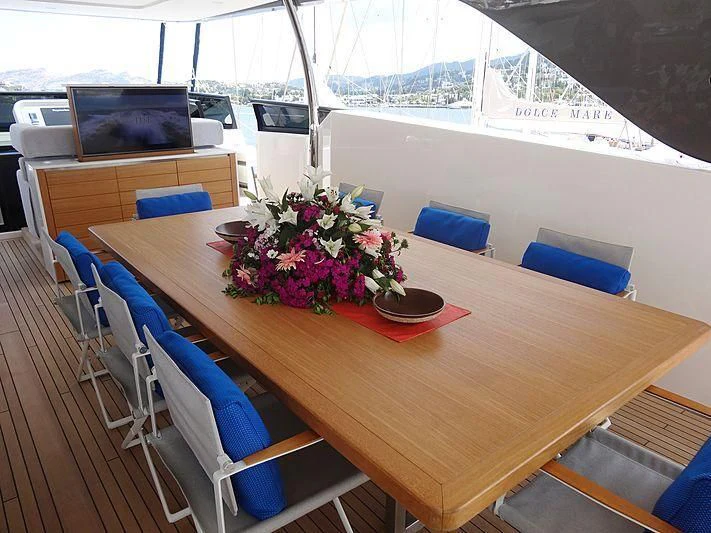 a table with a bowl of flowers on it aboard MORNING STAR Yacht for Charter