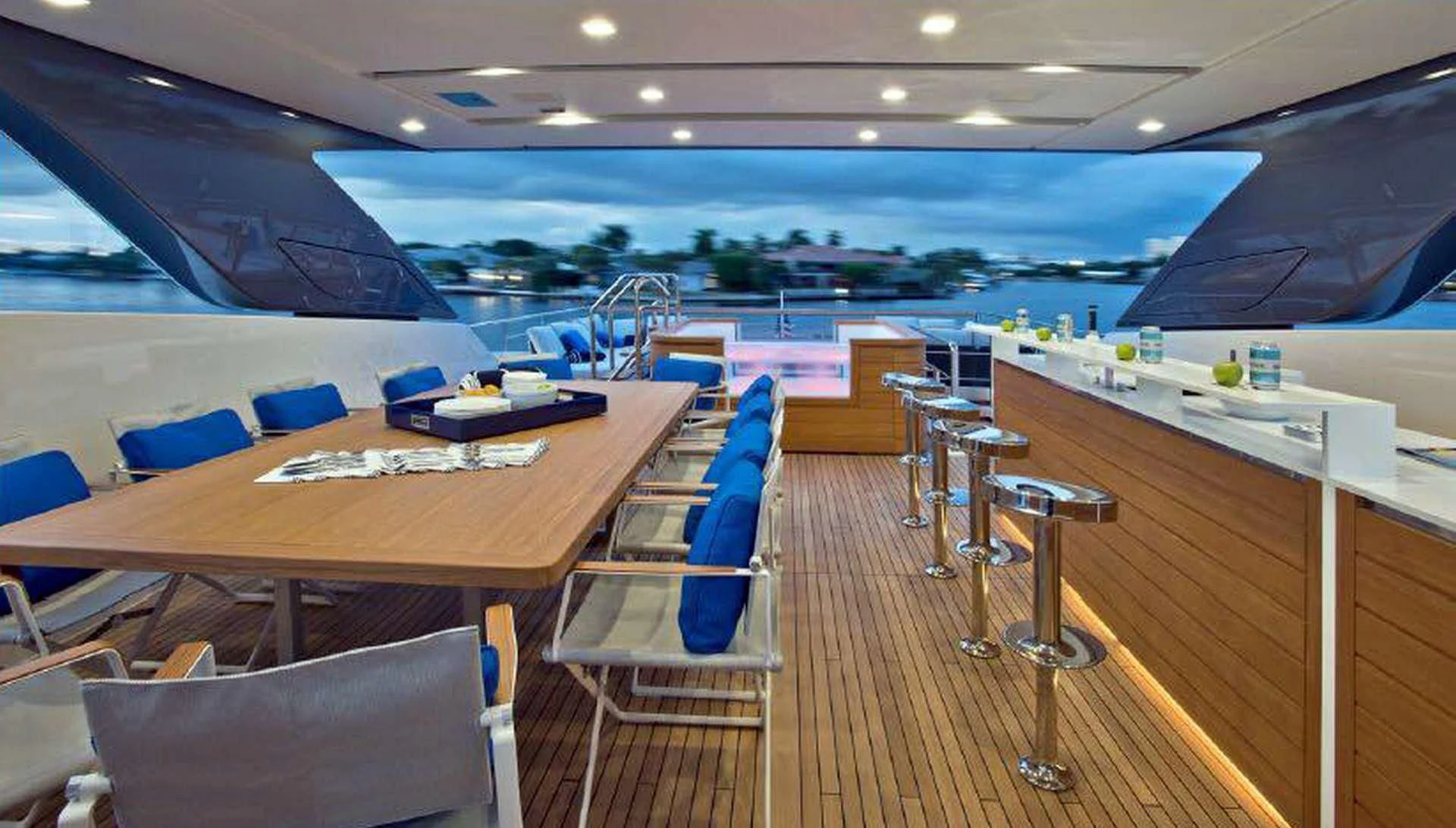 a room with a table chairs and a large window aboard MORNING STAR Yacht for Charter