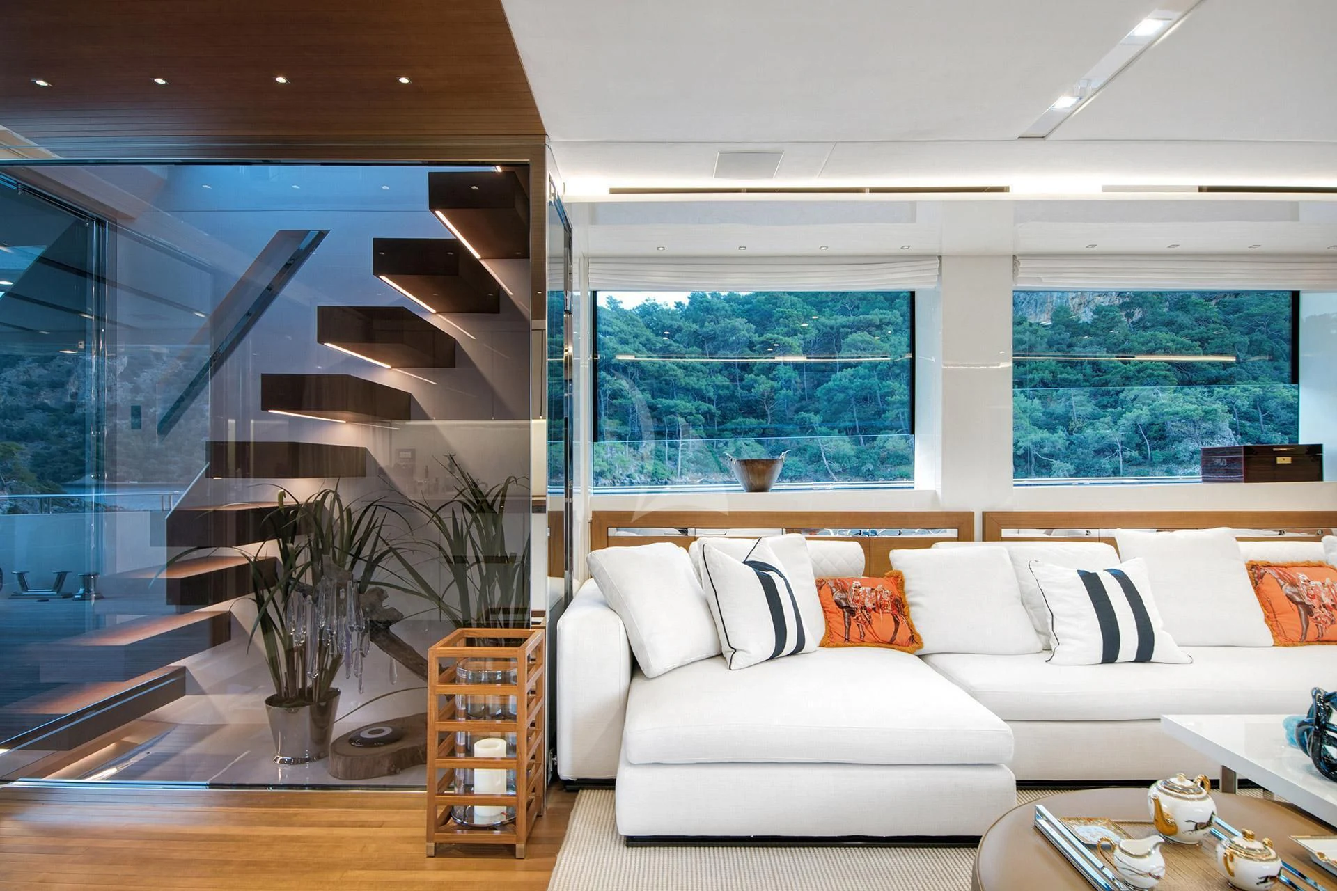 a living room with a large glass window aboard MORNING STAR Yacht for Charter