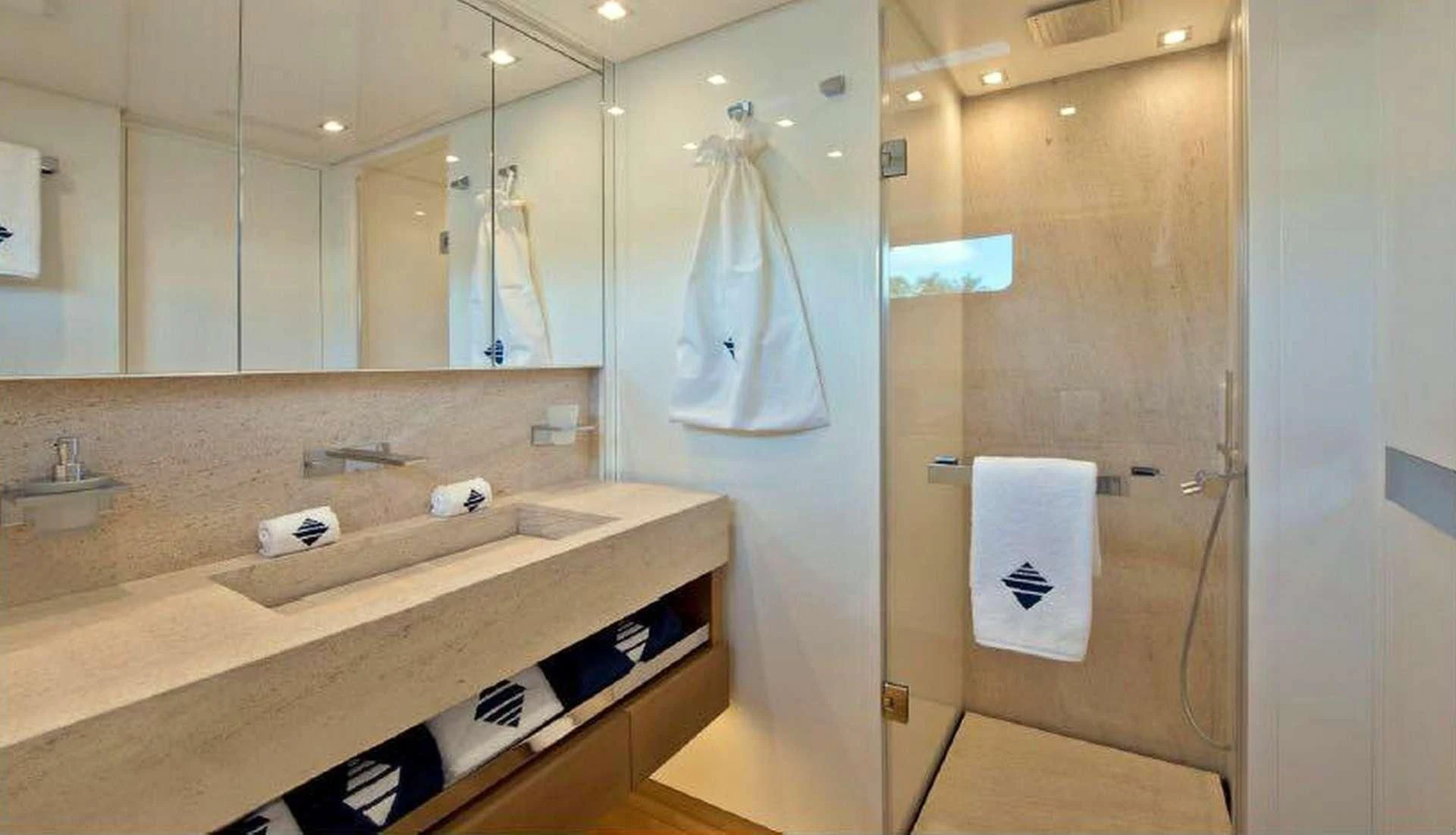 a bathroom with a countertop sink and mirror aboard MORNING STAR Yacht for Charter