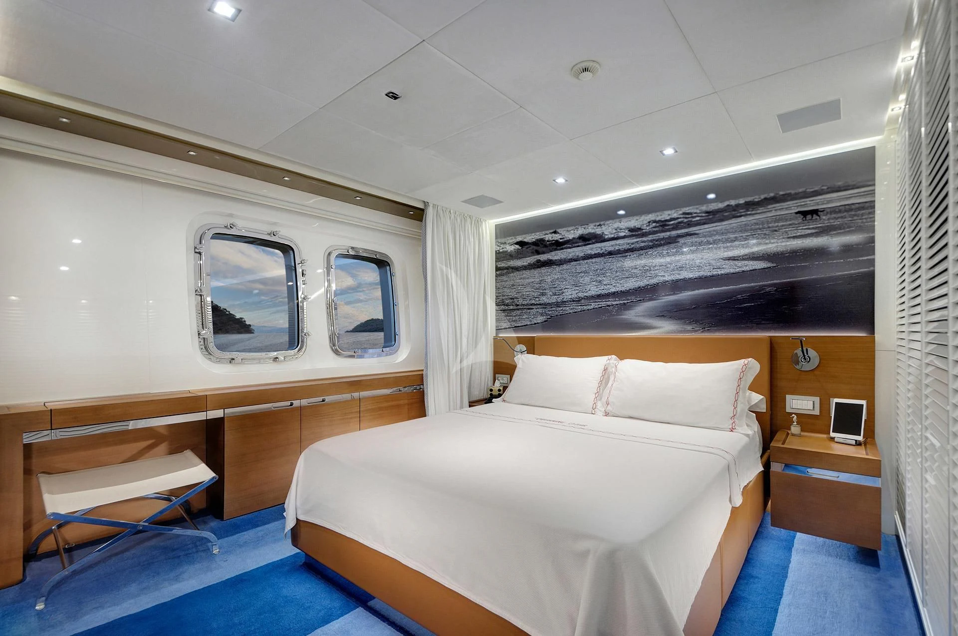 a room with a bed and a window aboard MORNING STAR Yacht for Charter