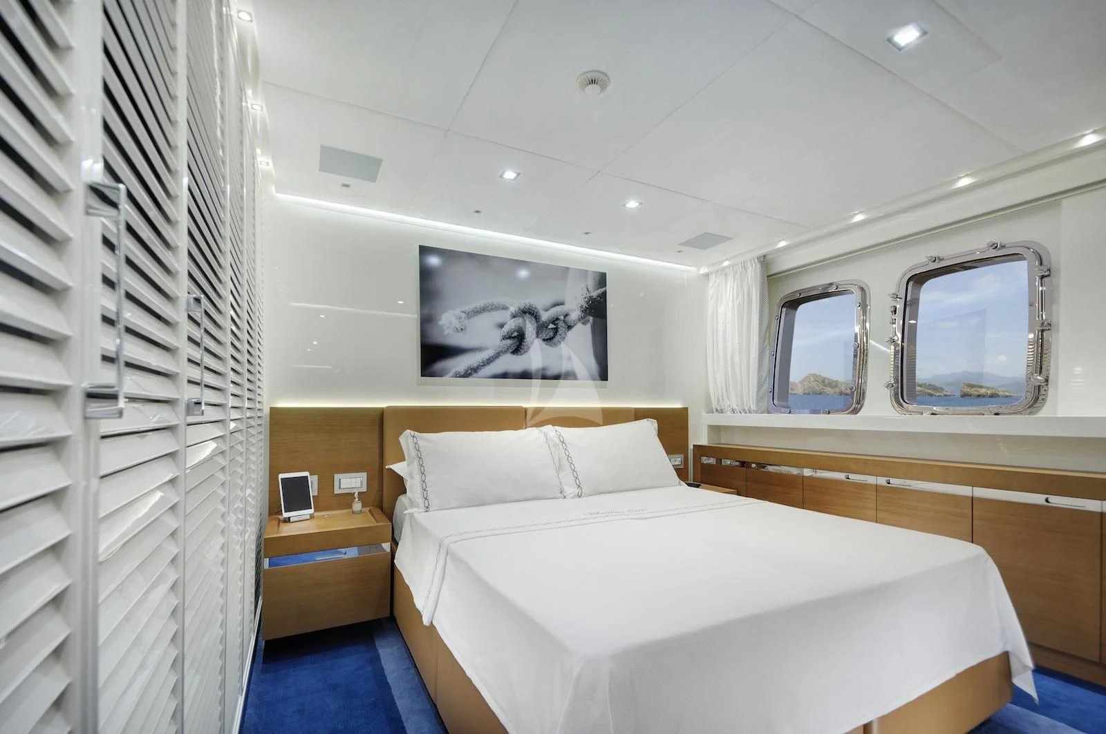 a room with a bed and a shelf aboard MORNING STAR Yacht for Charter