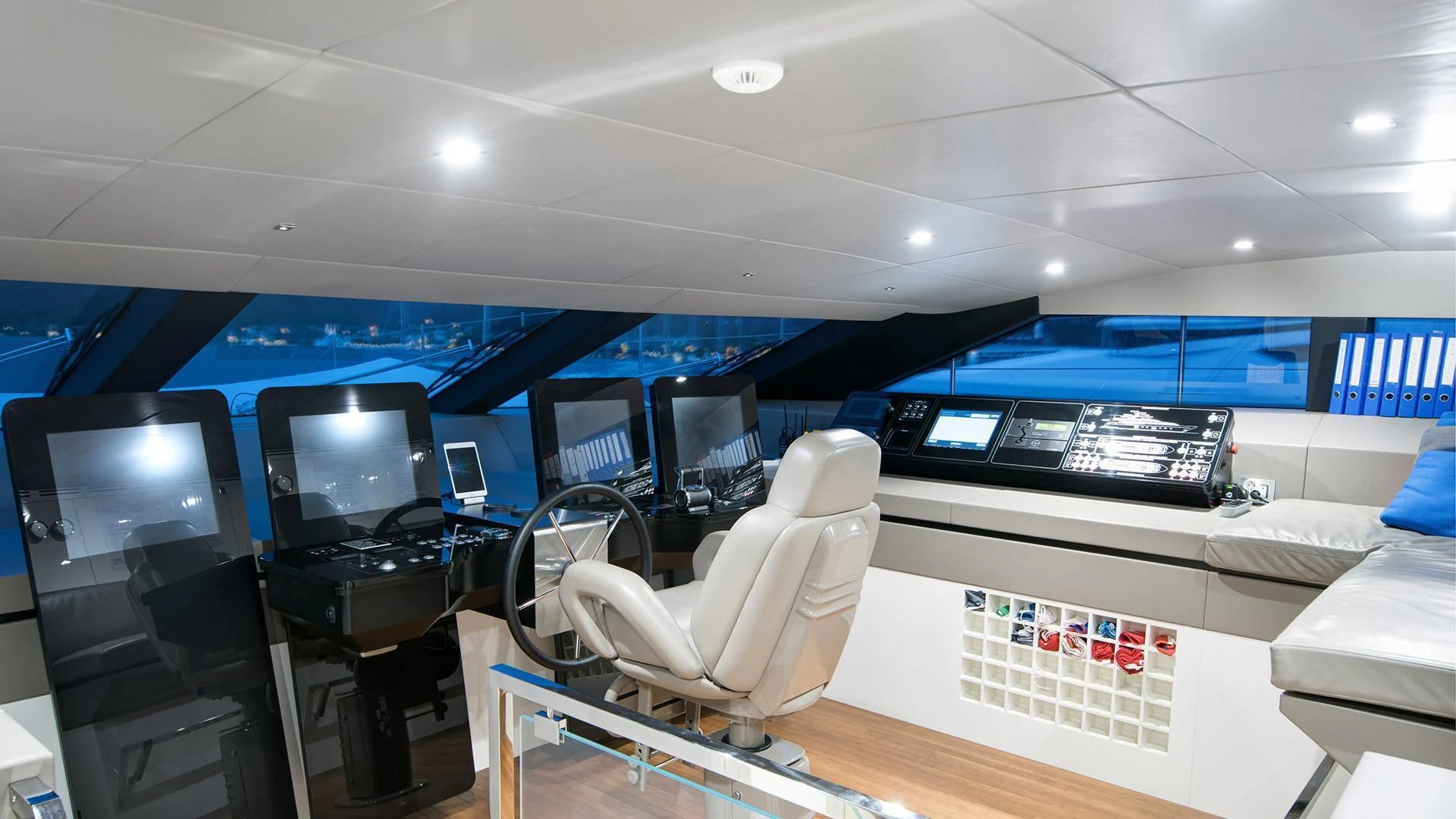 a room with computers and chairs aboard MORNING STAR Yacht for Charter