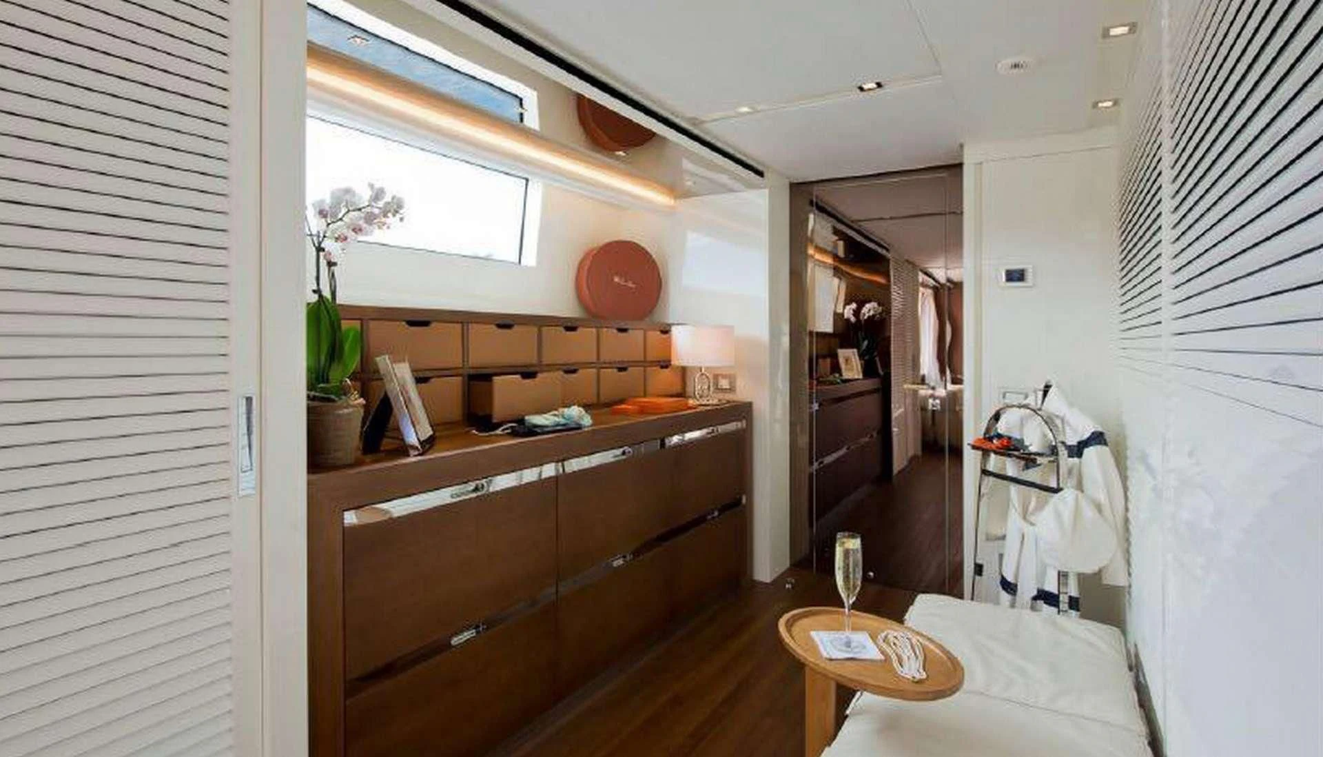 a bedroom with a bed and a desk aboard MORNING STAR Yacht for Charter