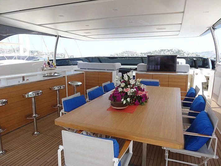 a room with a table and chairs aboard MORNING STAR Yacht for Charter