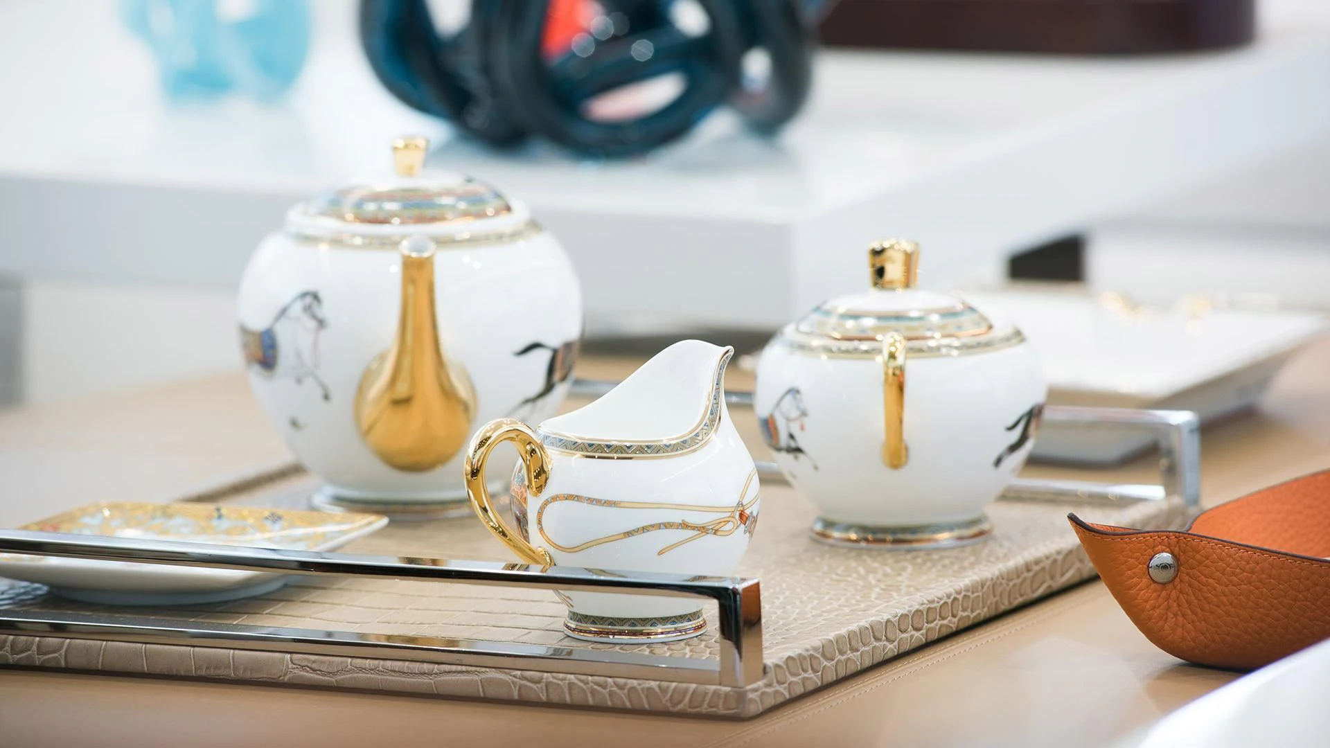 a group of teapots and tea cups on a table aboard MORNING STAR Yacht for Charter