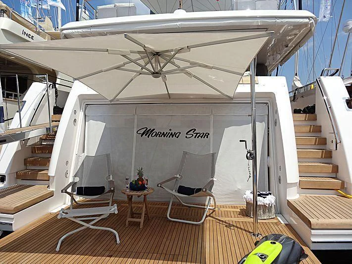 a boat with a white canopy aboard MORNING STAR Yacht for Charter