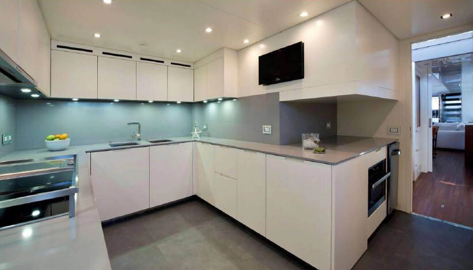 a kitchen with white cabinets aboard MORNING STAR Yacht for Charter