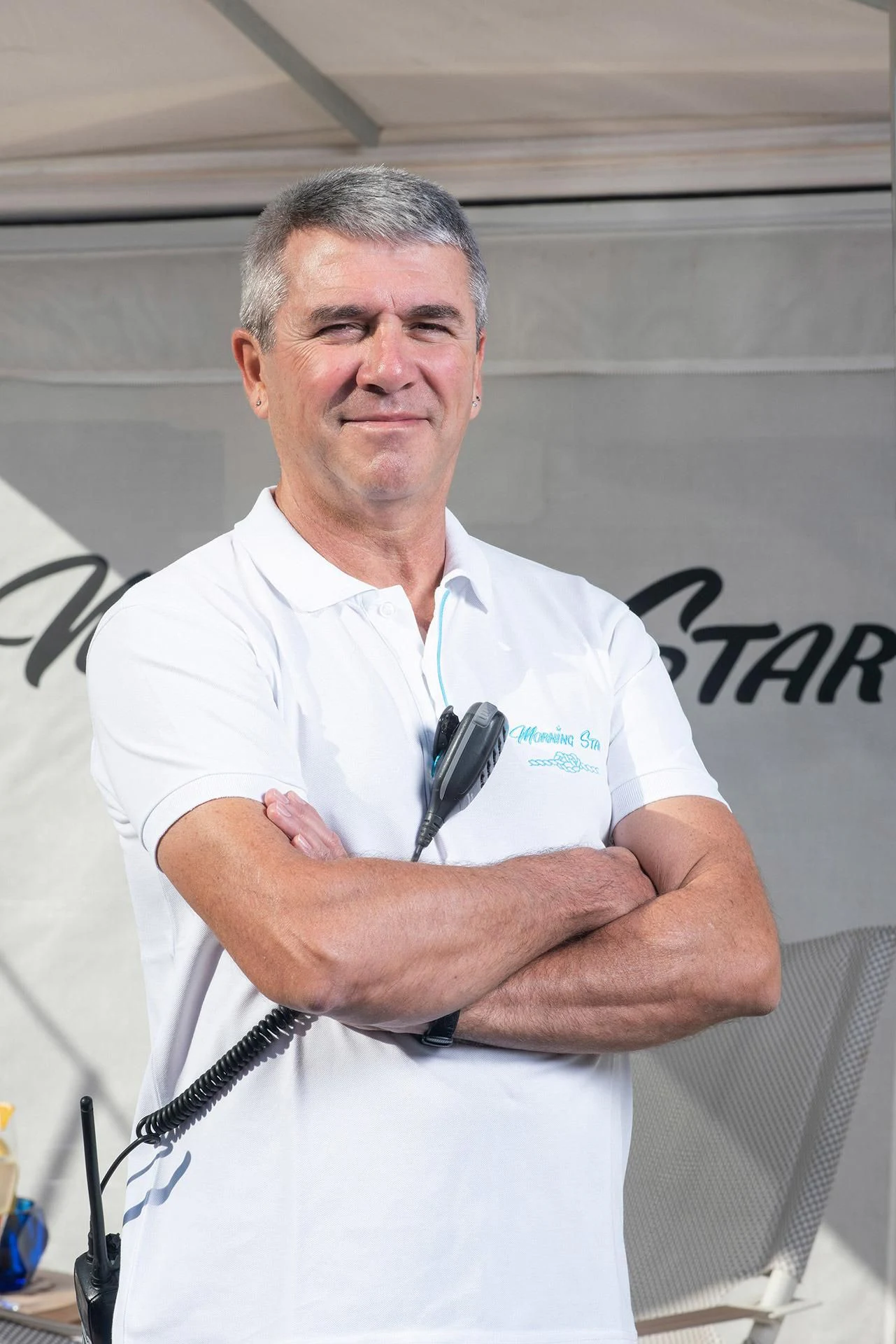a man in a white lab coat aboard MORNING STAR Yacht for Charter