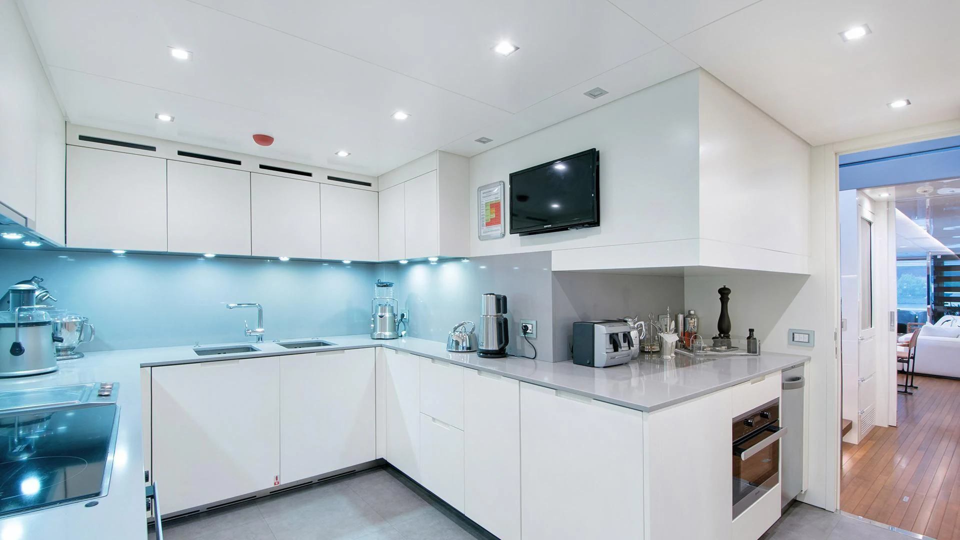 a kitchen with white cabinets aboard MORNING STAR Yacht for Charter