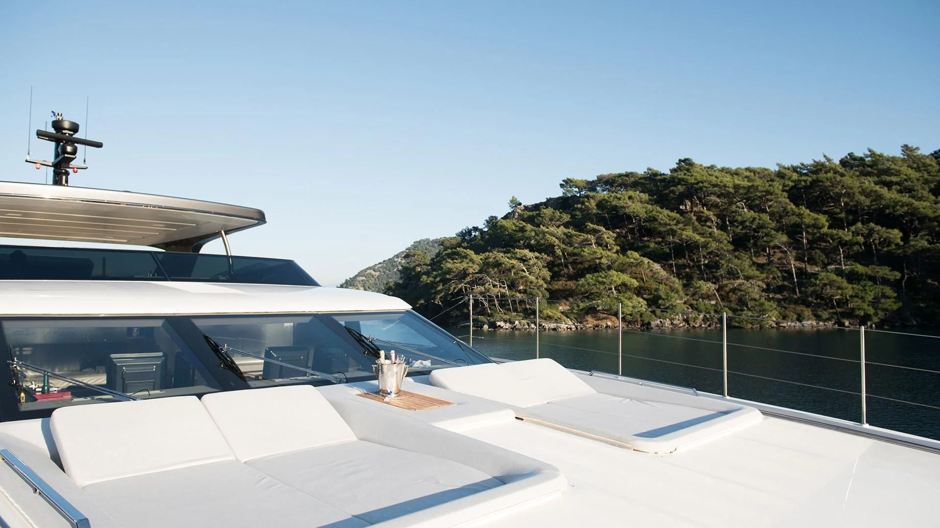 a rooftop with a pool and trees aboard MORNING STAR Yacht for Charter
