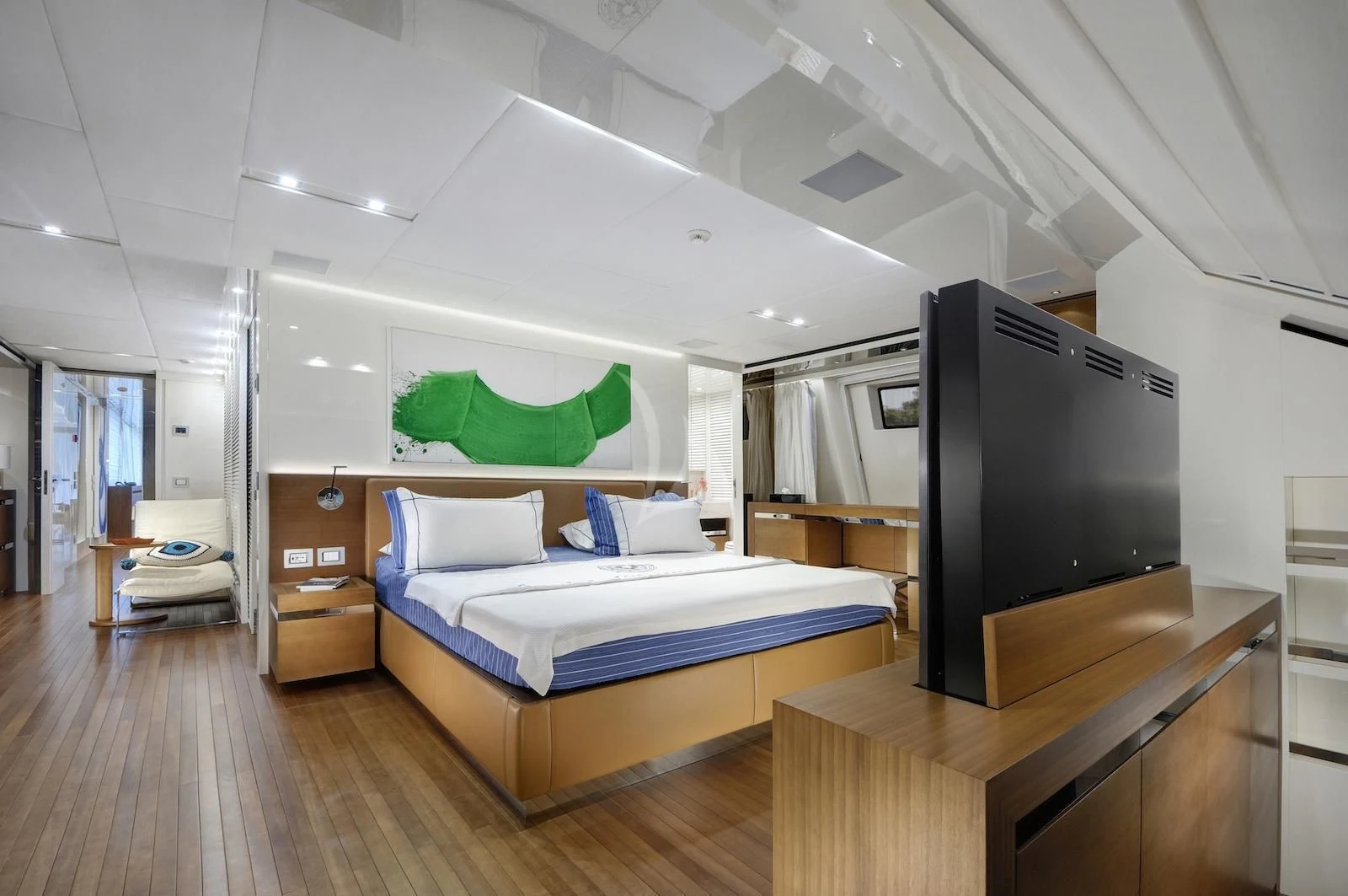 a bedroom with a bed and a tv aboard MORNING STAR Yacht for Charter