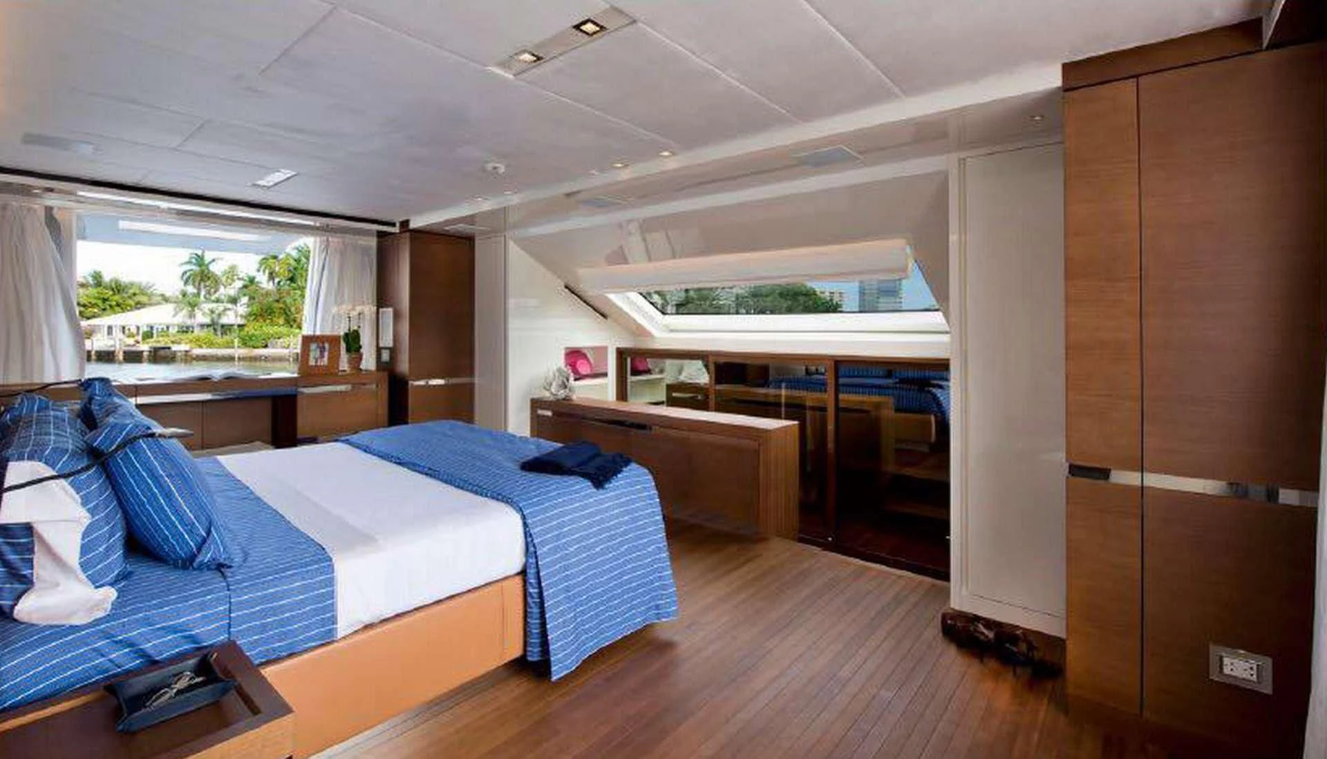 a room with beds and a desk aboard MORNING STAR Yacht for Charter