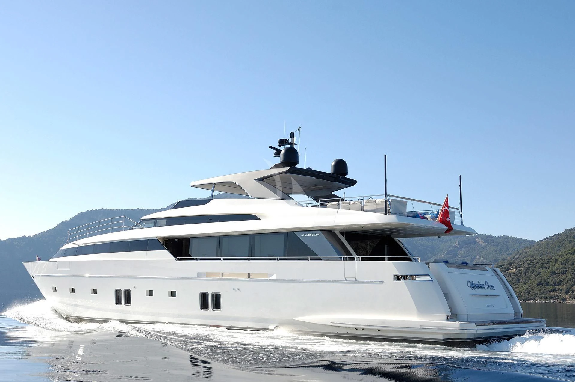 a white yacht on a beach aboard MORNING STAR Yacht for Charter