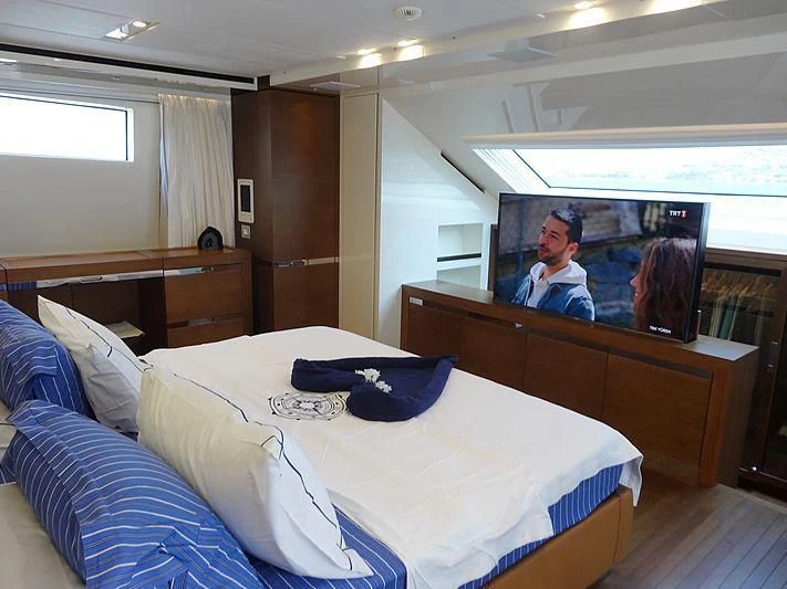 a hotel room with a tv on the wall aboard MORNING STAR Yacht for Charter
