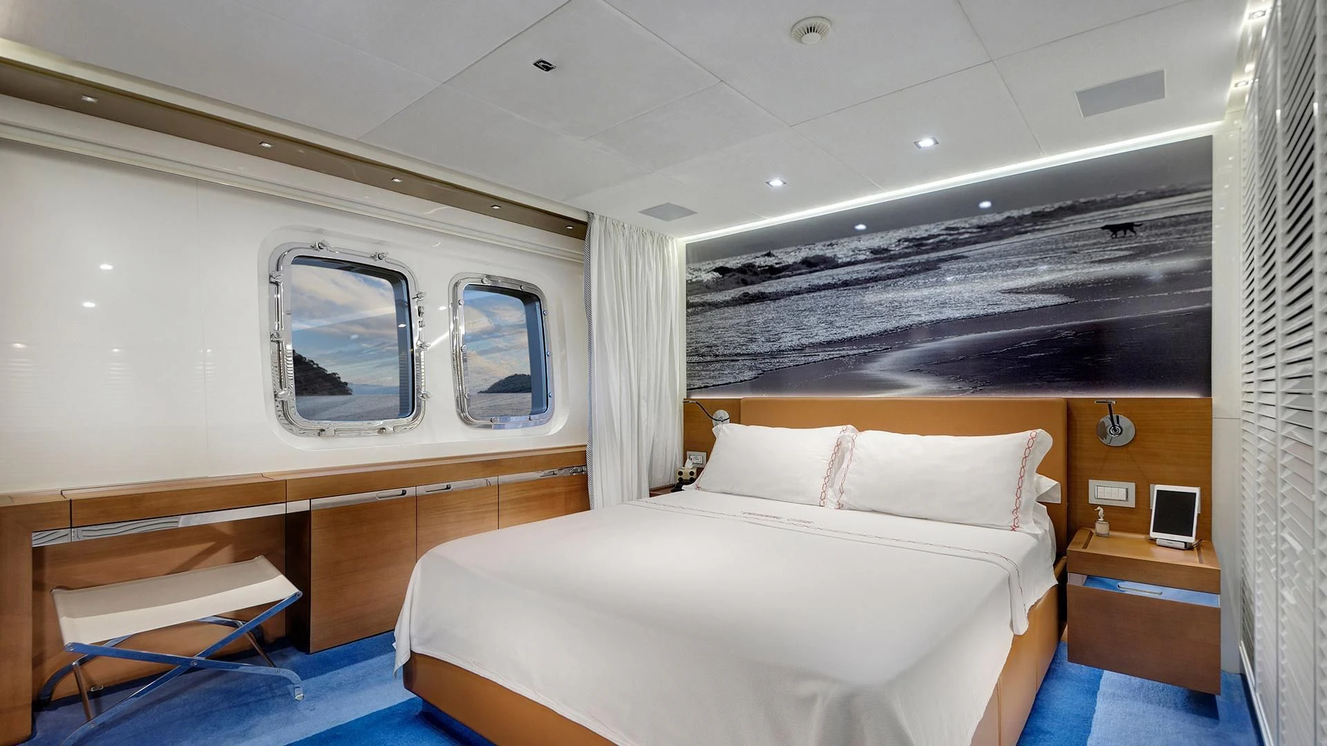 a room with a bed and a window aboard MORNING STAR Yacht for Charter