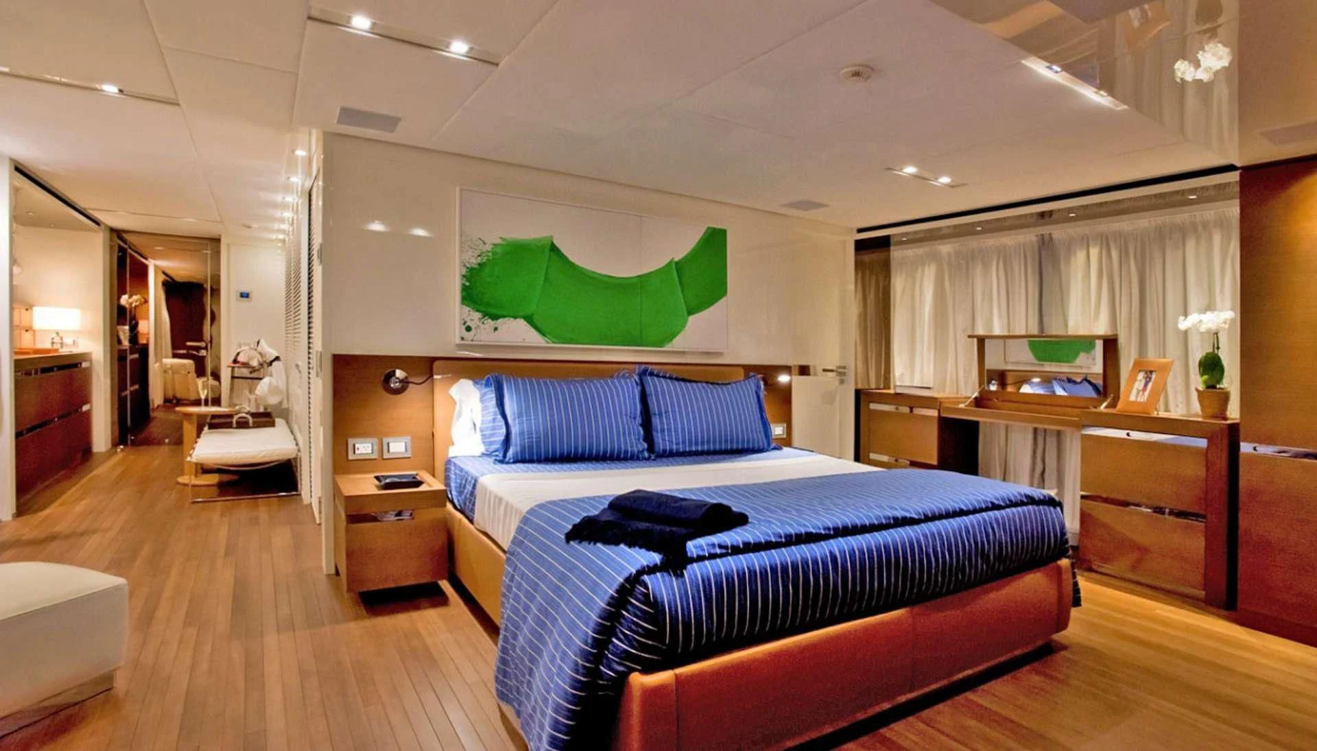 a bedroom with a bed and desk aboard MORNING STAR Yacht for Charter