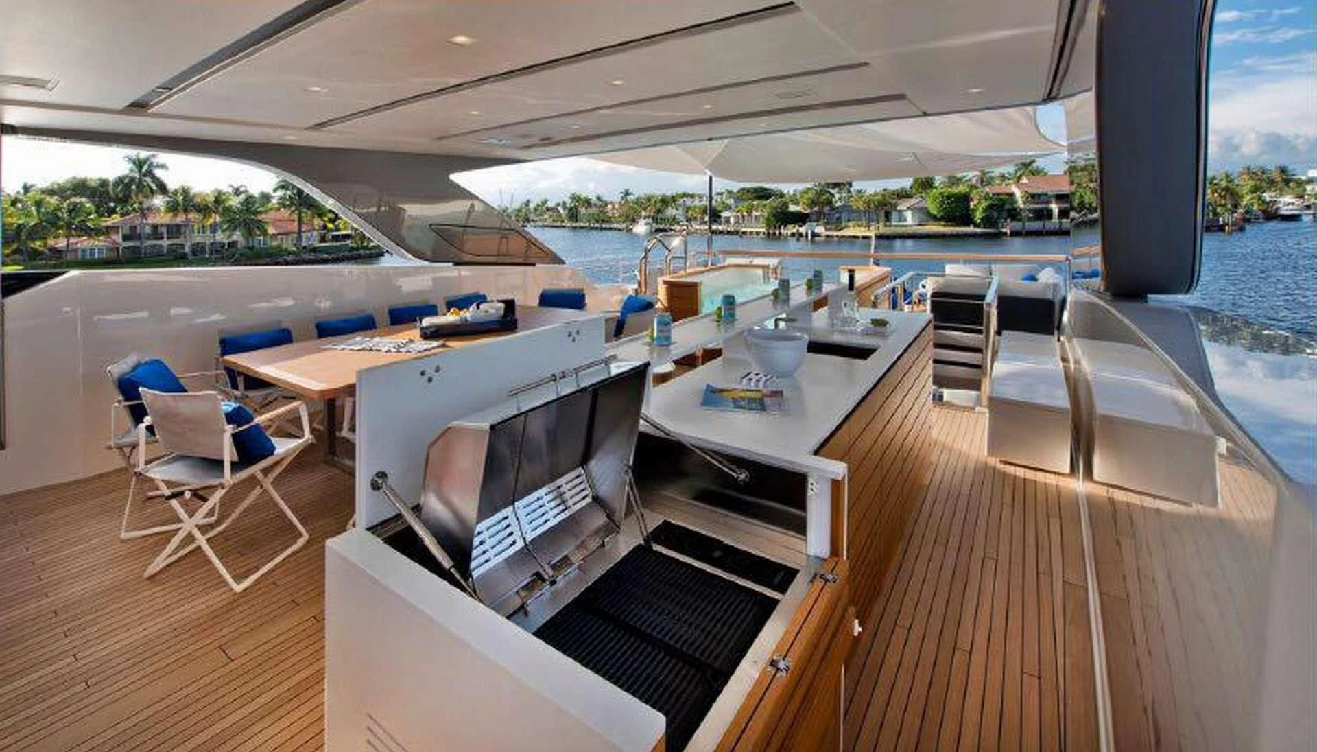 a deck with a bar and a grill on it aboard MORNING STAR Yacht for Charter