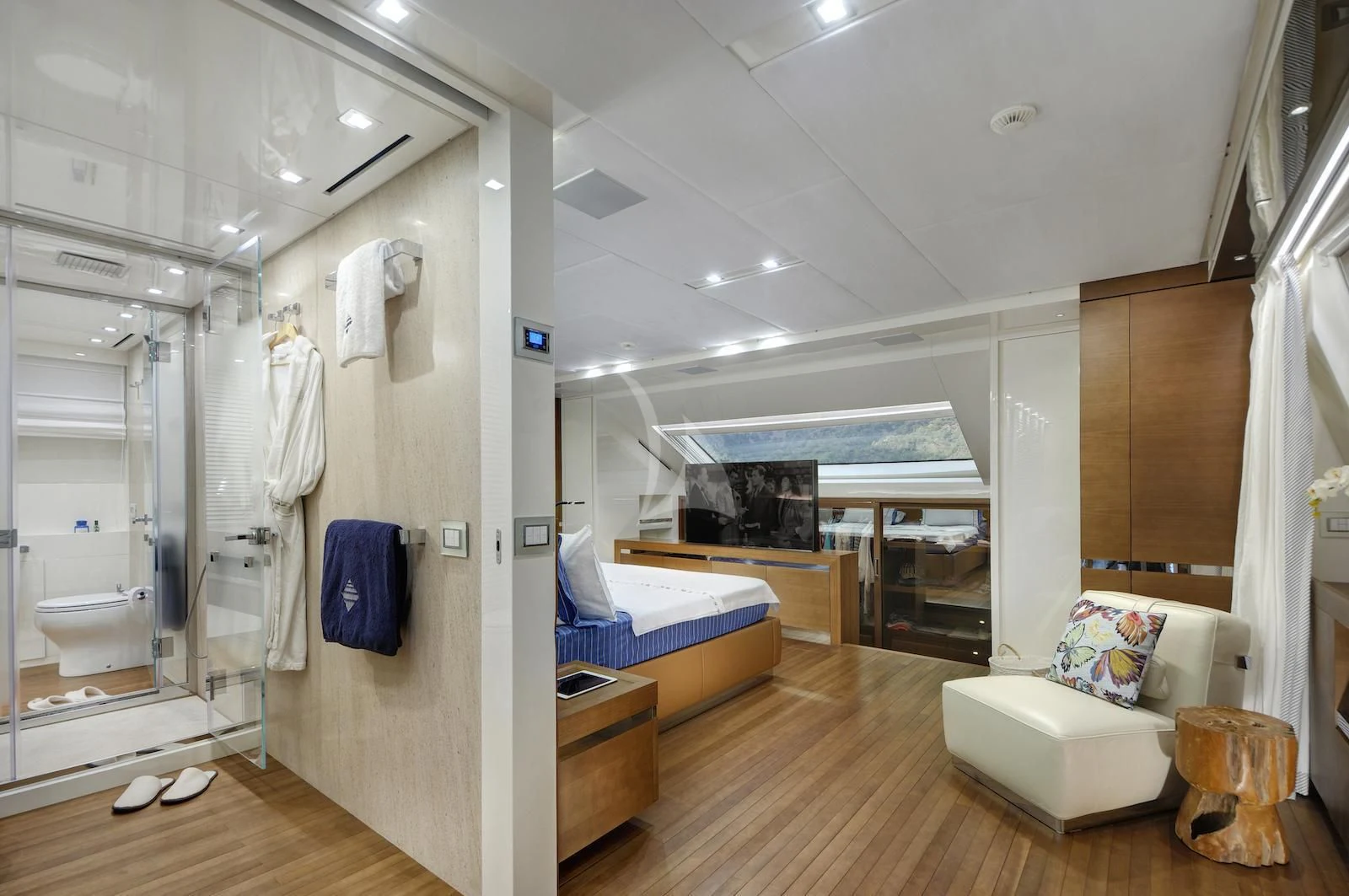 a room with a bed and a mirror aboard MORNING STAR Yacht for Charter