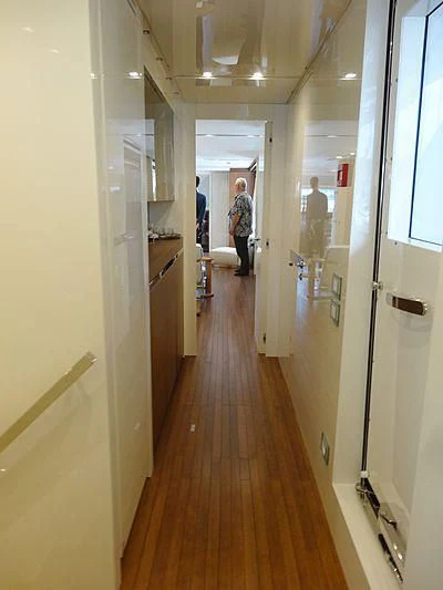 a hallway with a person standing in the doorway aboard MORNING STAR Yacht for Charter