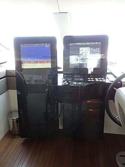 a computer on a desk aboard MORNING STAR Yacht for Charter