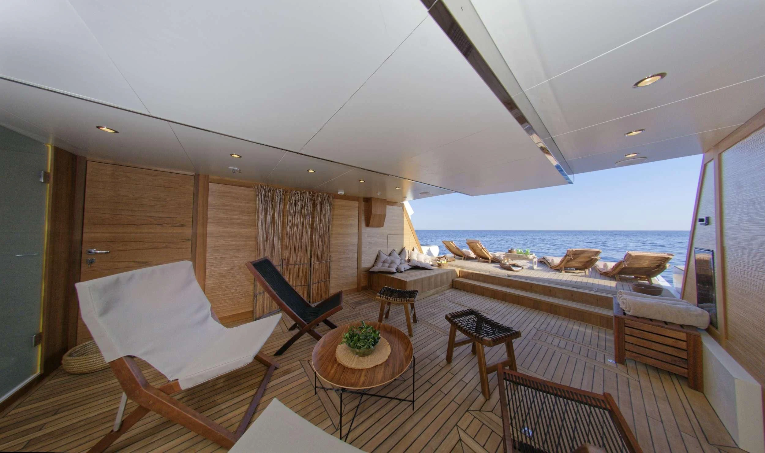 a large room with a large balcony aboard GRANDE AMORE Yacht for Charter