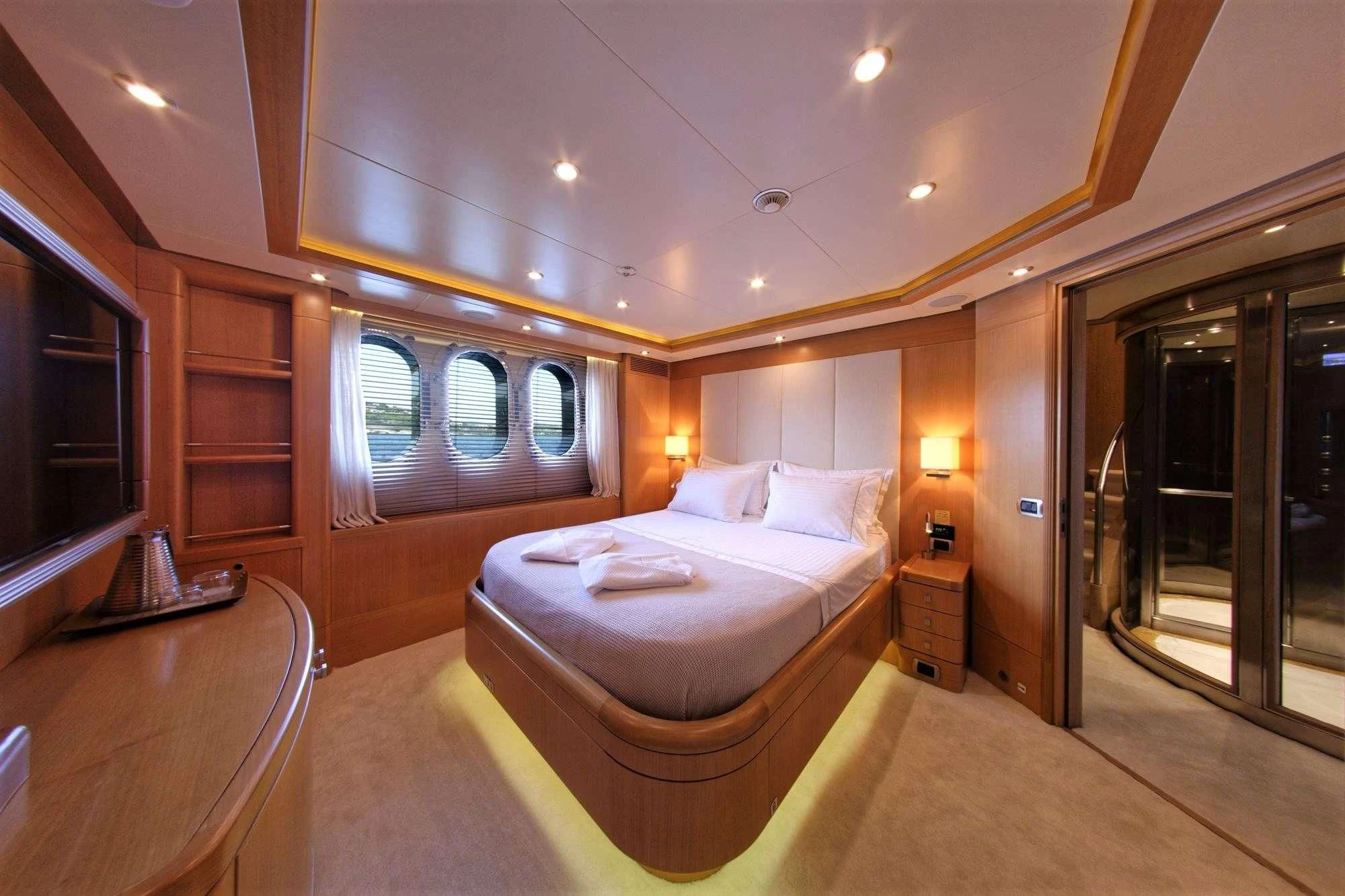 a large bedroom with a bed aboard GRANDE AMORE Yacht for Charter
