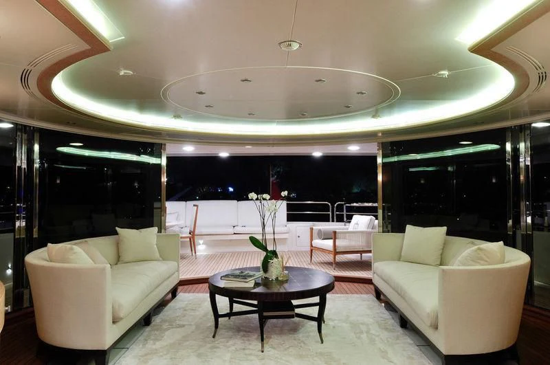 a room with a table and chairs aboard GRANDE AMORE Yacht for Charter