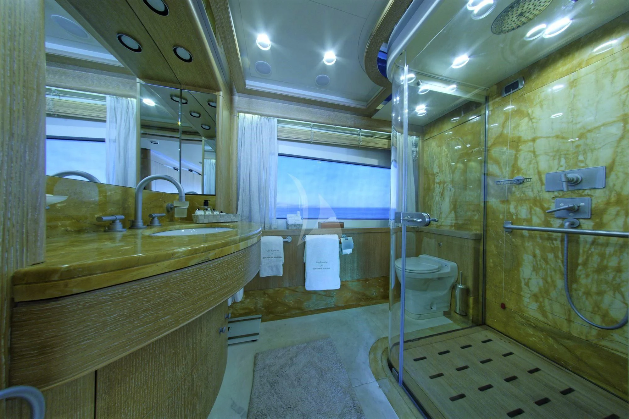 a bathroom with a sink and a mirror aboard GRANDE AMORE Yacht for Charter
