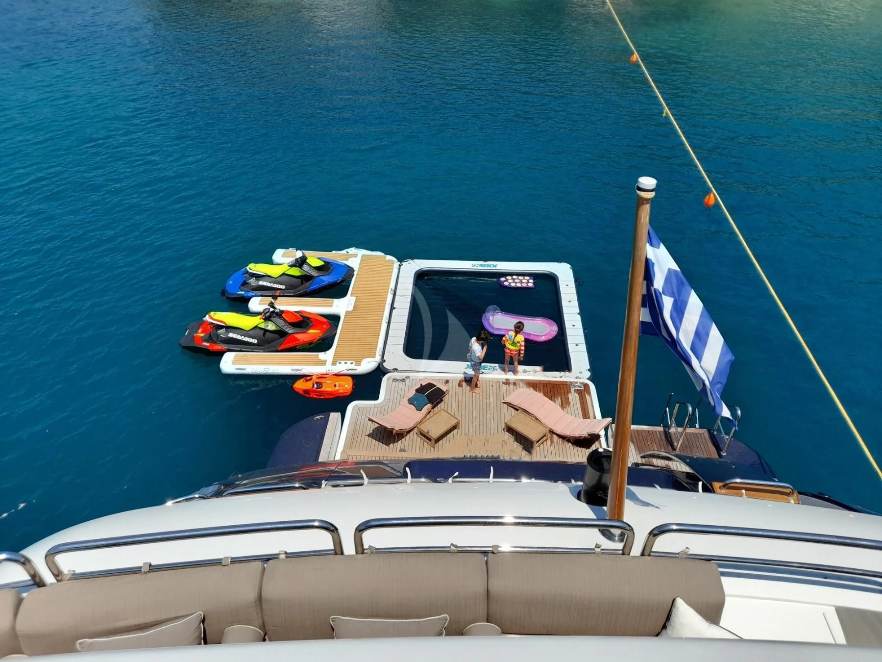 a boat with a flag on it aboard GRANDE AMORE Yacht for Charter