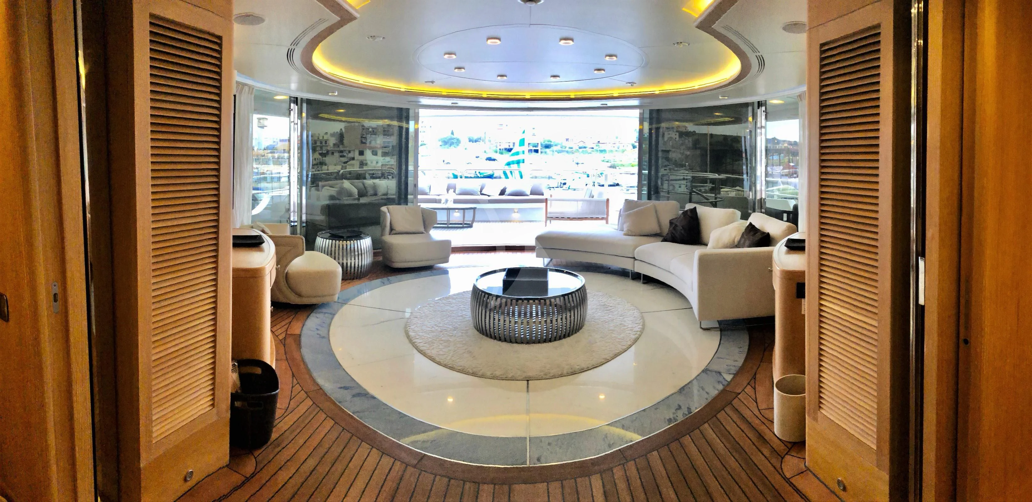 a living room with a large glass window aboard GRANDE AMORE Yacht for Charter