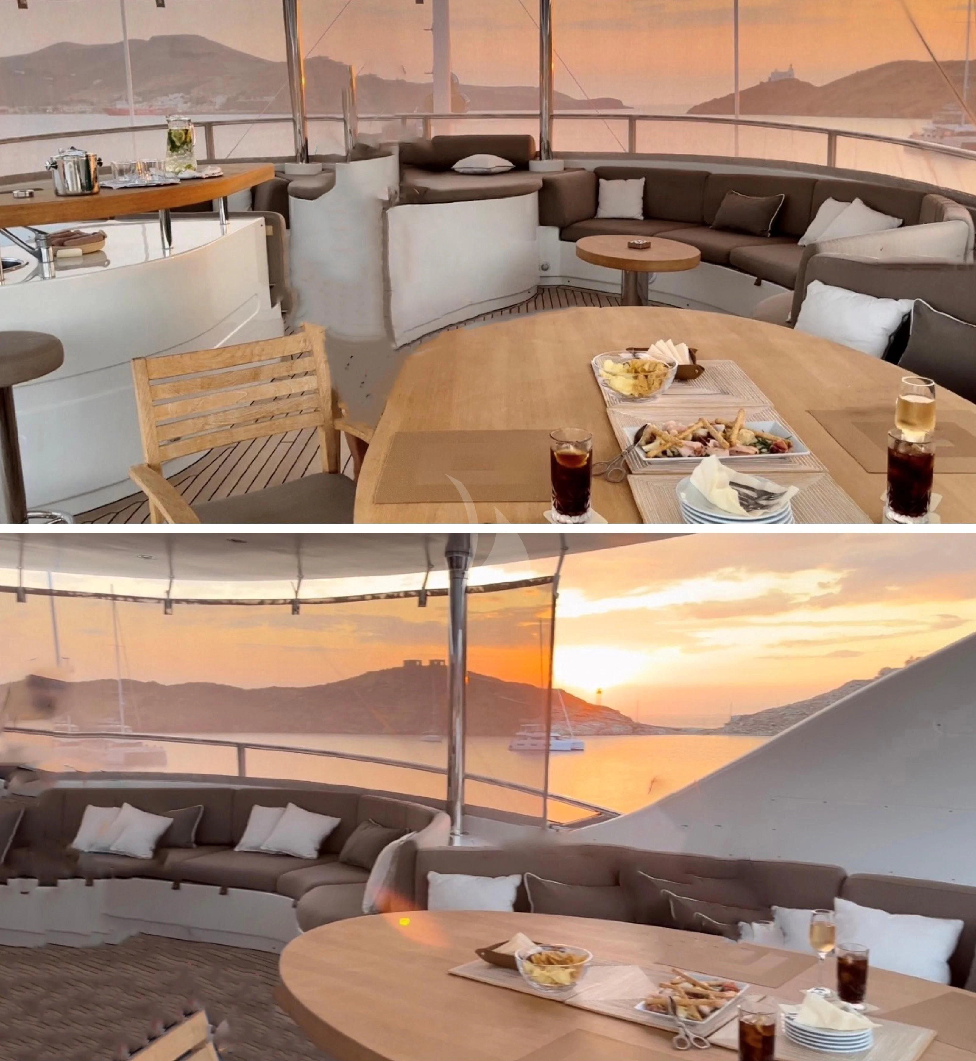 a room with a couch and a table with chairs aboard GRANDE AMORE Yacht for Charter