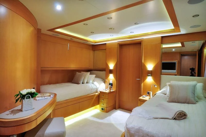 a hotel room with two beds aboard GRANDE AMORE Yacht for Charter