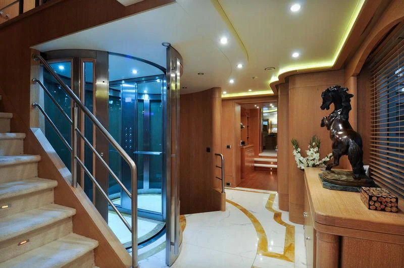 a large room with a statue aboard GRANDE AMORE Yacht for Charter