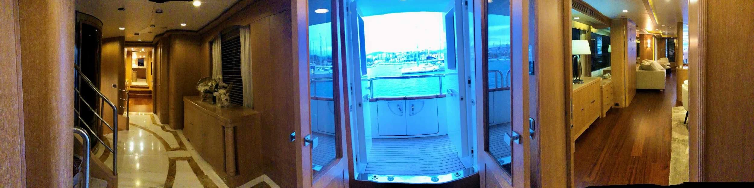 a hallway with a glass door aboard GRANDE AMORE Yacht for Charter
