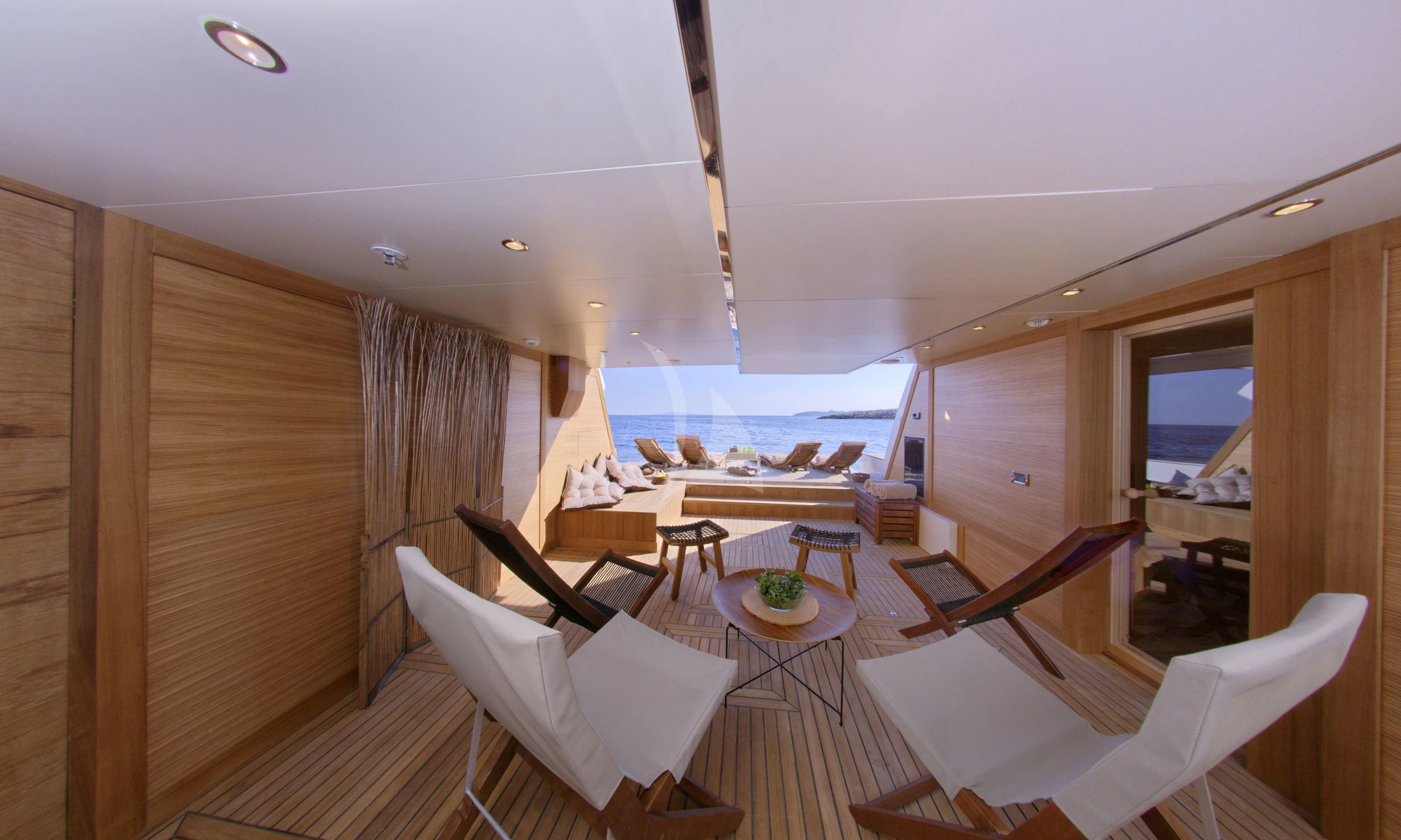 a room with a view of the ocean and the deck aboard GRANDE AMORE Yacht for Charter