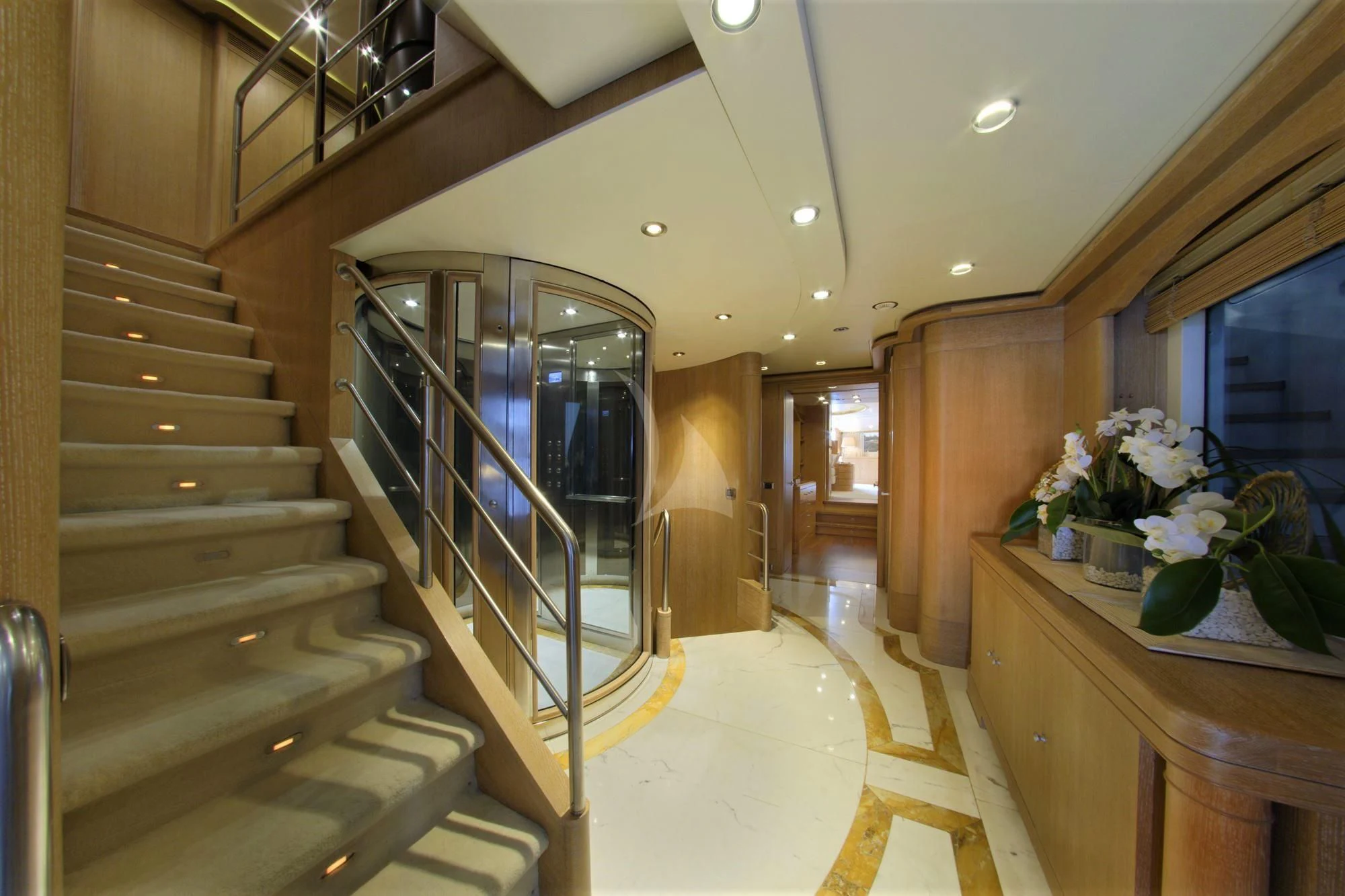 a large open staircase in a house aboard GRANDE AMORE Yacht for Charter