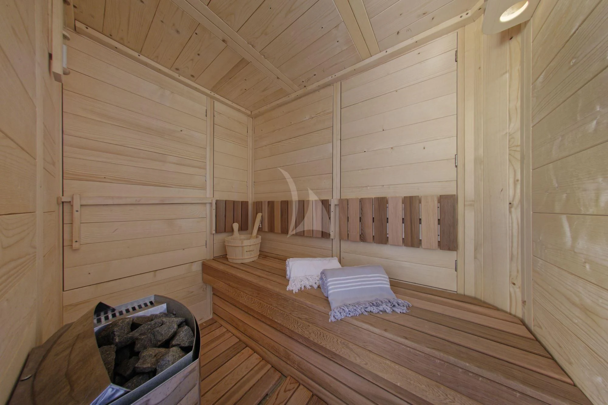 a wooden sauna with a bed aboard GRANDE AMORE Yacht for Charter