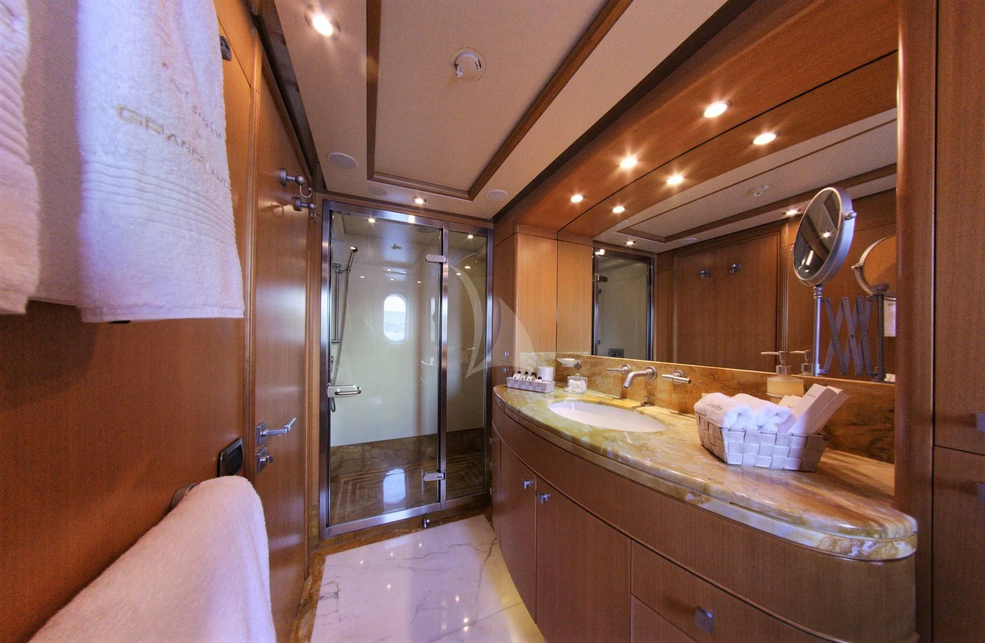 a bathroom with a large mirror aboard GRANDE AMORE Yacht for Charter